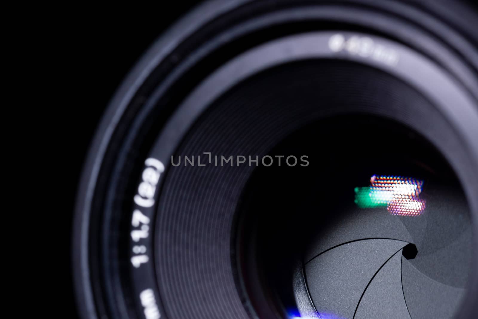 Lens aperture low light photo. closeup. Aperture blades is clean and dark. Stock photo isolated on black background.