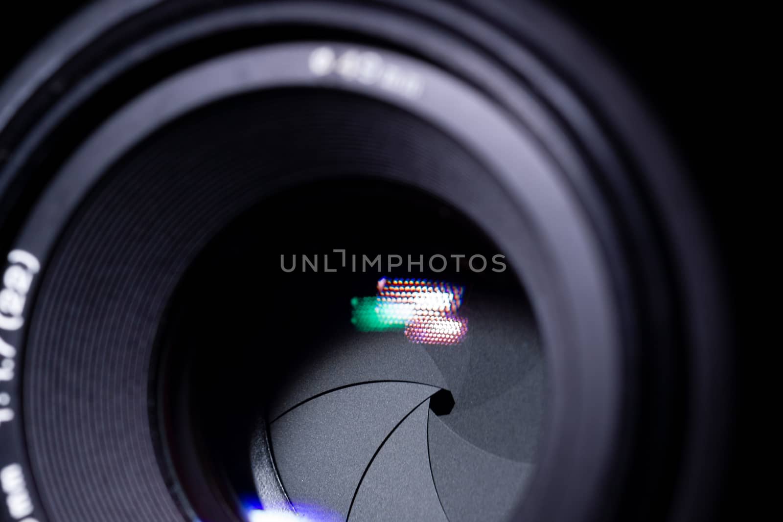 Lens aperture low light photo. closeup. Aperture blades is clean and dark. Stock photo isolated on black background.