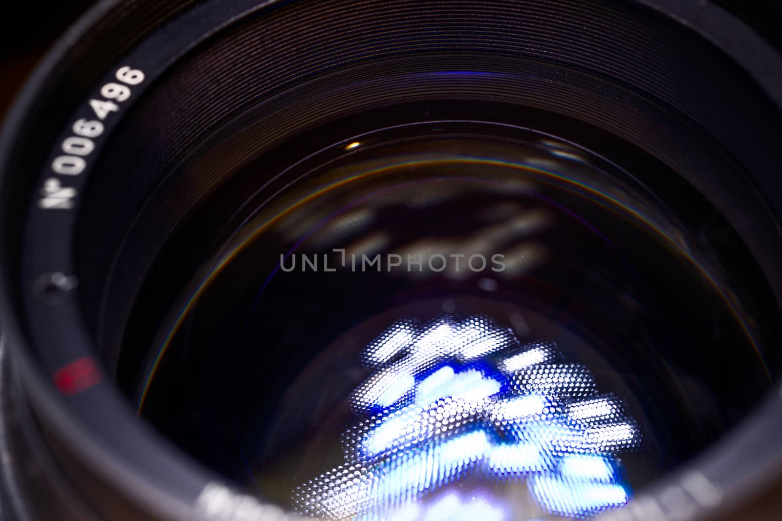 Vintage old lens low light photo closeup. White traces on glass.