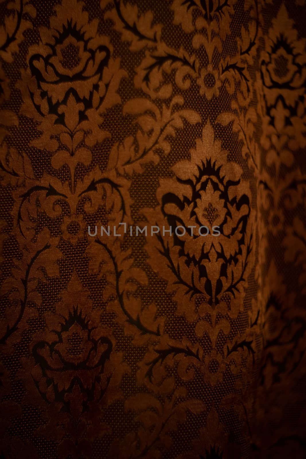 Expensive dark orange home curtains with a very beautiful frilly pattern. Texture shot. Good background or wallpapers. by alexsdriver