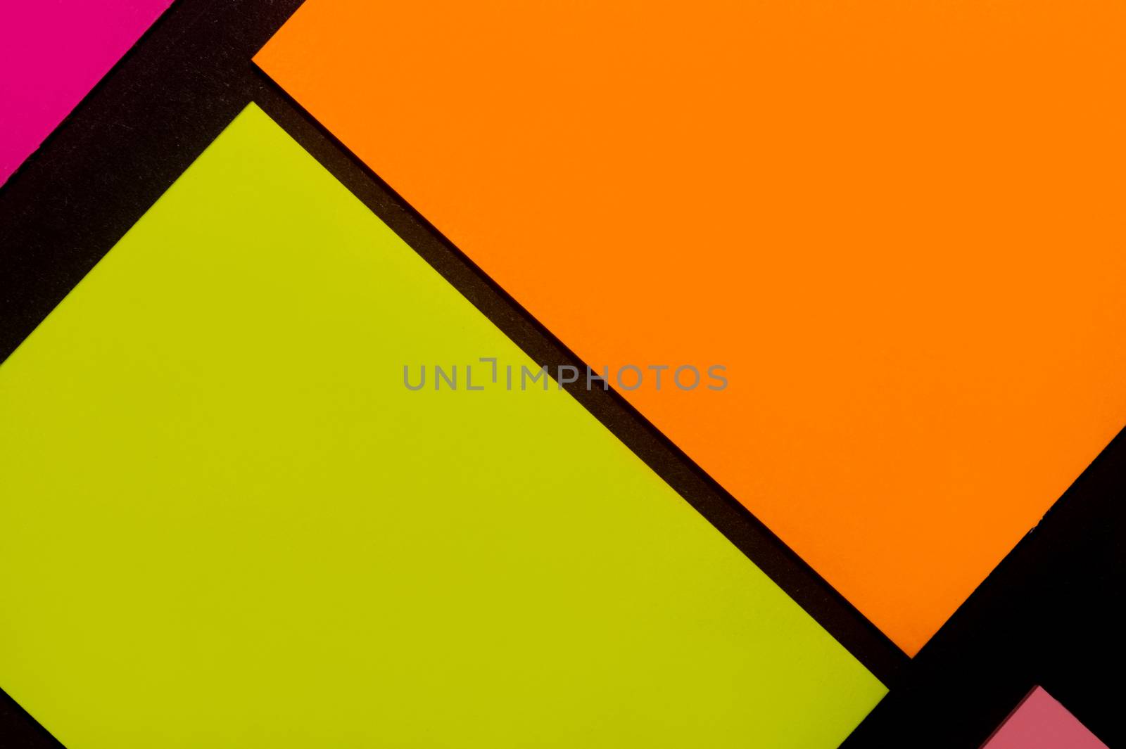 Purple, yellow, orange and rose hue colorful office stickers on black paper. Office noteparer as reminder. Isolated on black paper.
