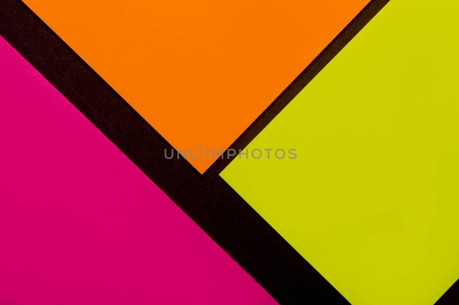 Purple, yellow and orange hue colorful office stickers on black paper. Office noteparer as reminder. Isolated on black paper.