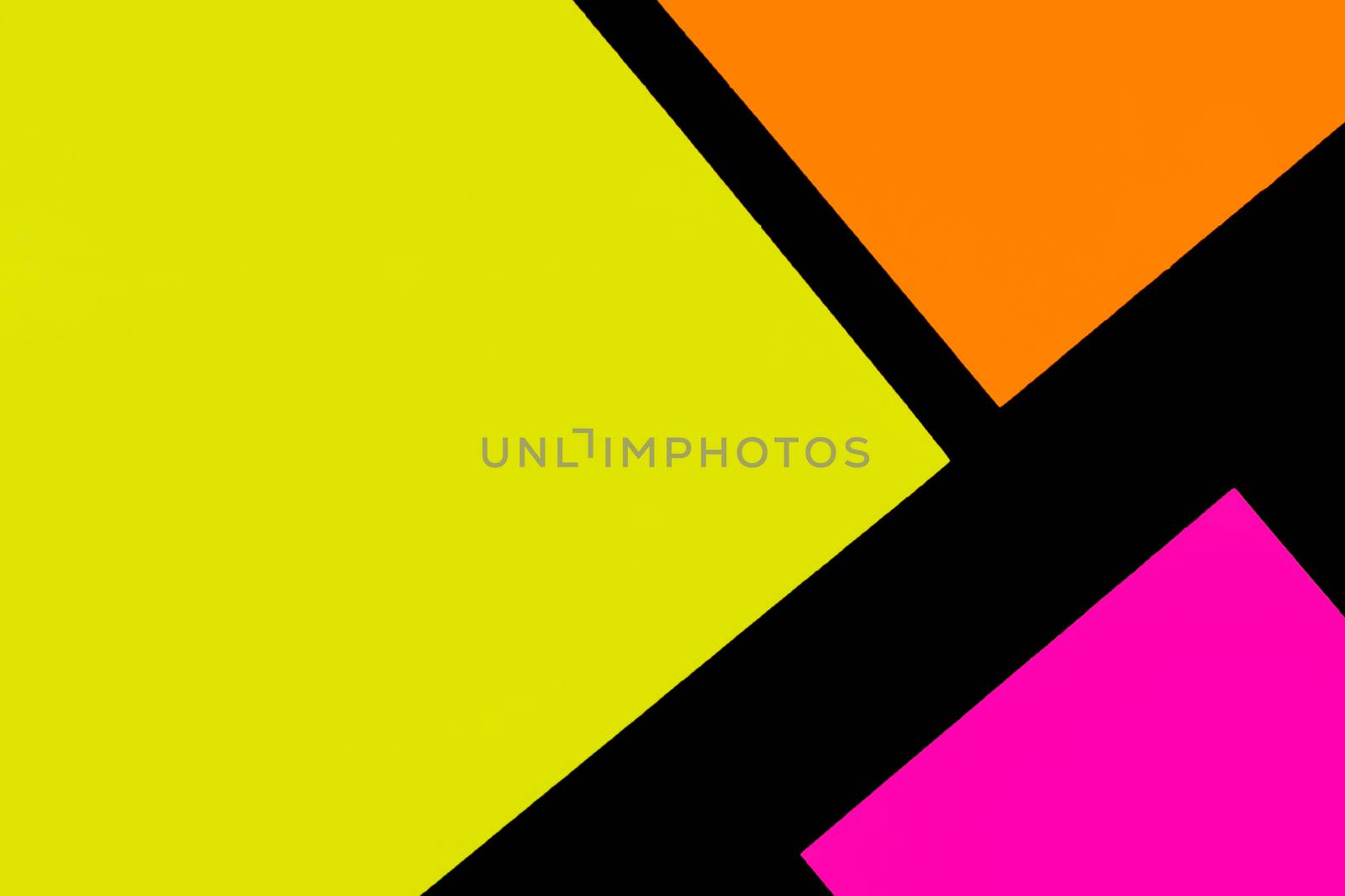 Yellow, orange and purple hue colorful office stickers on black paper. Office noteparer as reminder. Isolated on black paper.