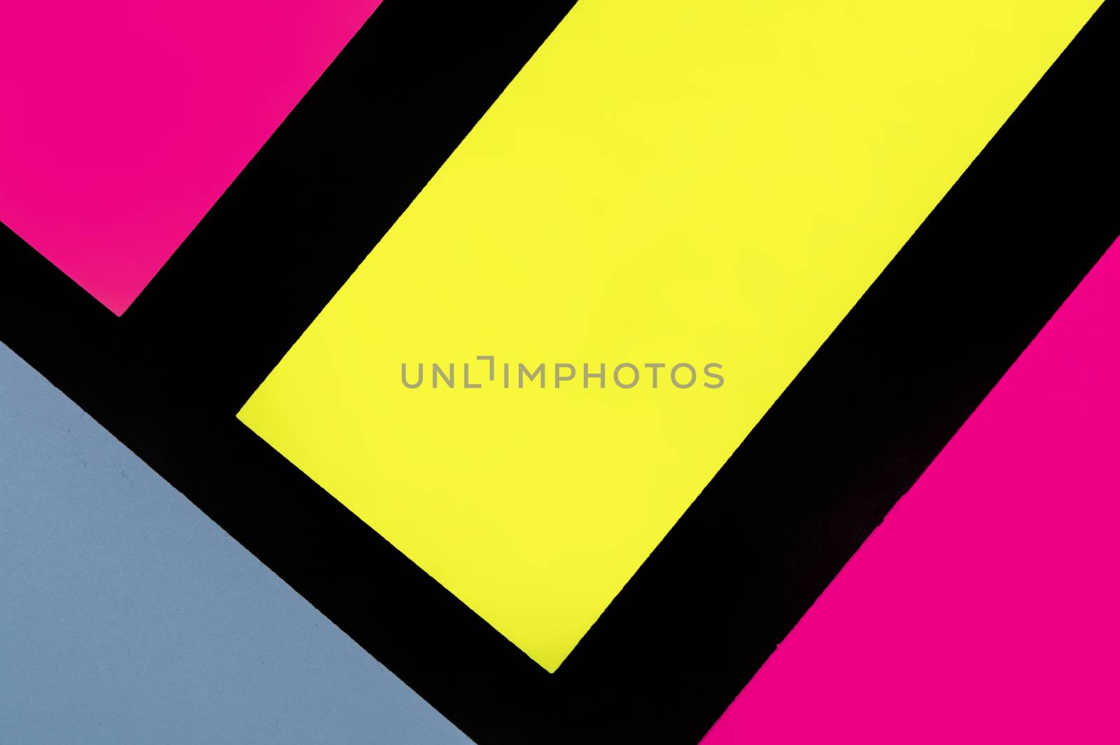 Blue, yellow and purple hue colorful office stickers on black paper. Office noteparer as reminder. Isolated on black paper.