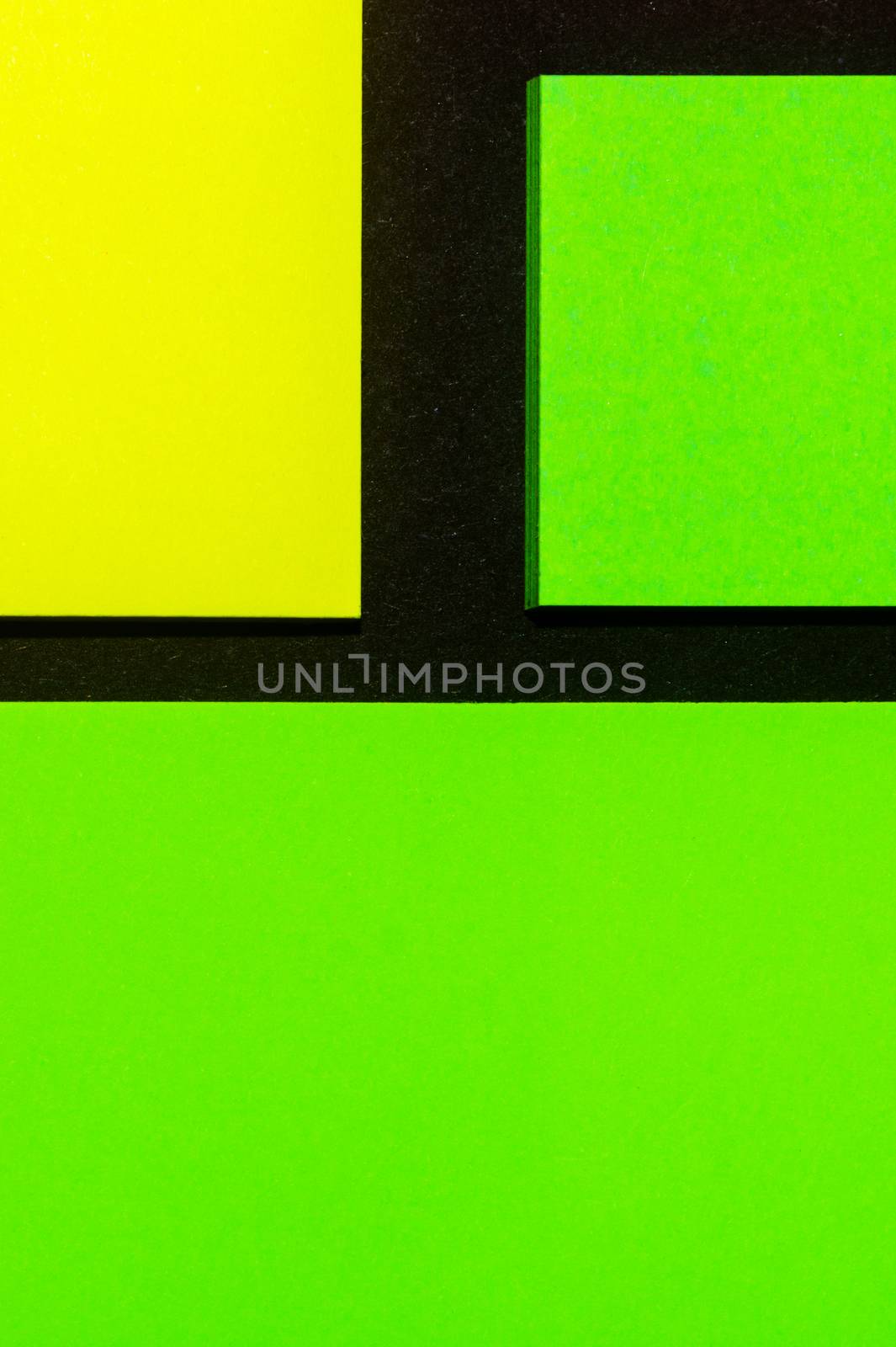 Green and yellow hue colorful office stickers on black paper. Office noteparer as reminder. Isolated on black paper. by alexsdriver