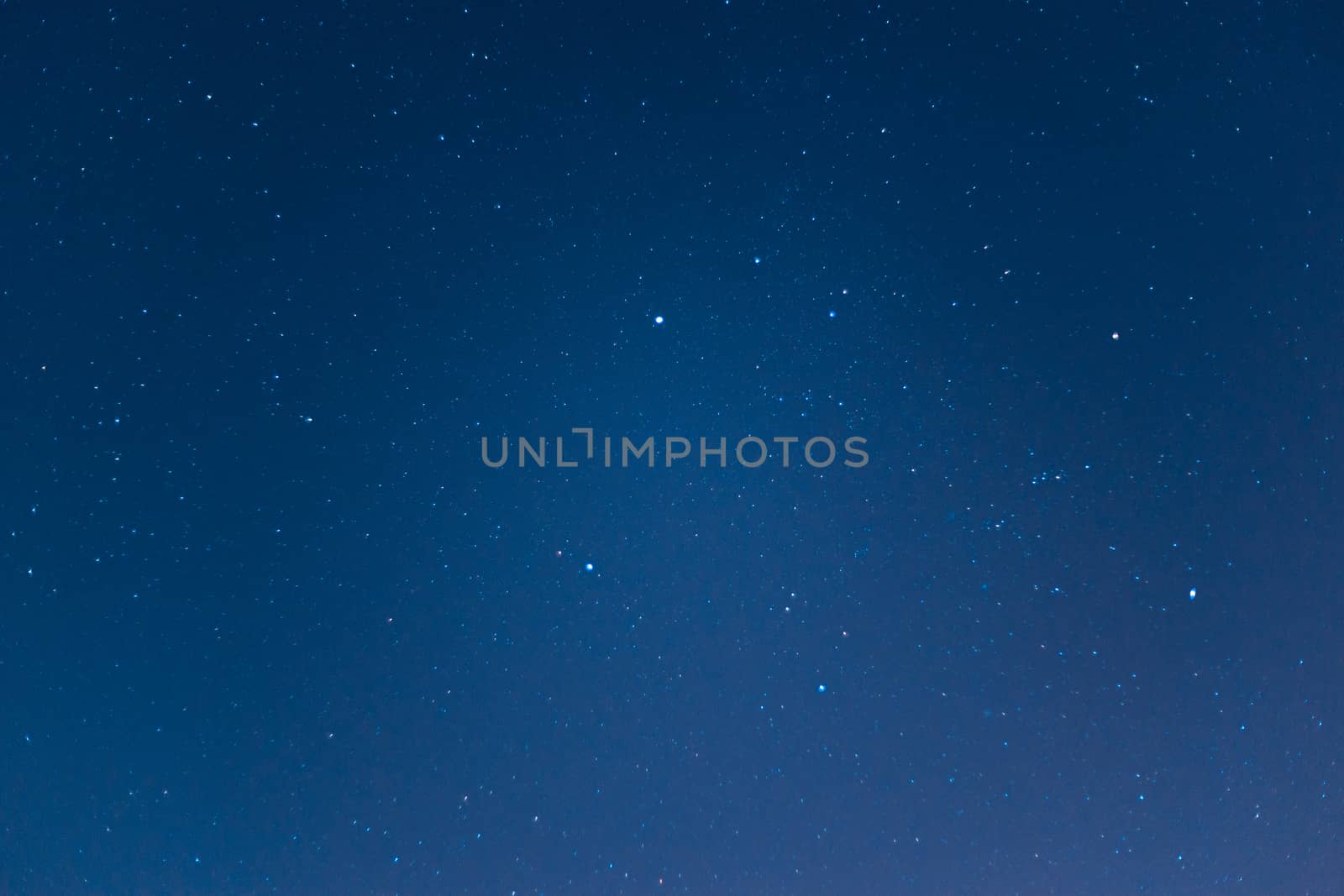 Long exposure night sky stars photo. A lot of stars with constellations. Far from the city. Night landscape.