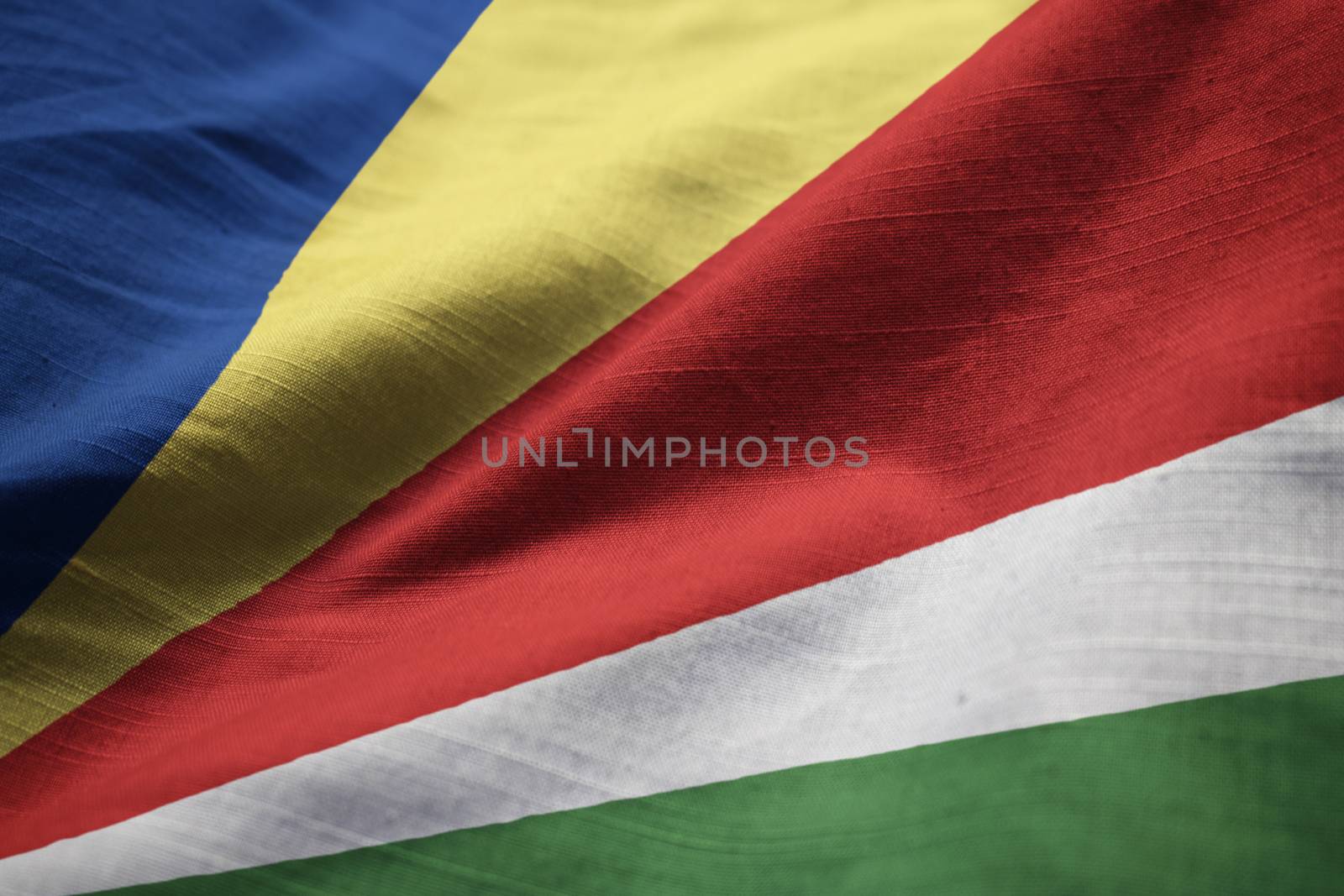 Closeup of Ruffled Seychelles Flag, Seychelles Flag Blowing in W by shaadjutt36