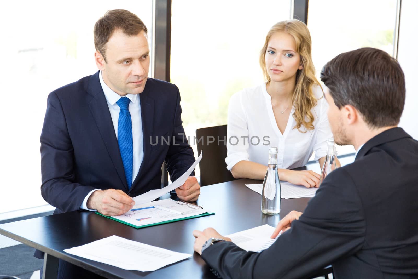 Group of business people discussing with analyzing data financial reports at the office desk