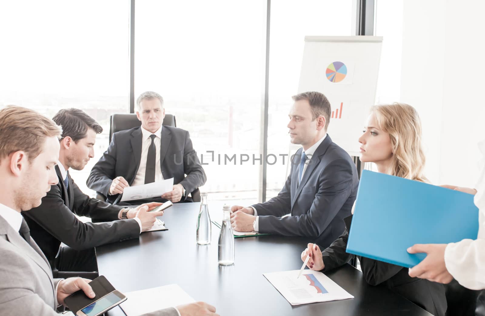 Group of business people discussing with analyzing data financial reports at the office desk