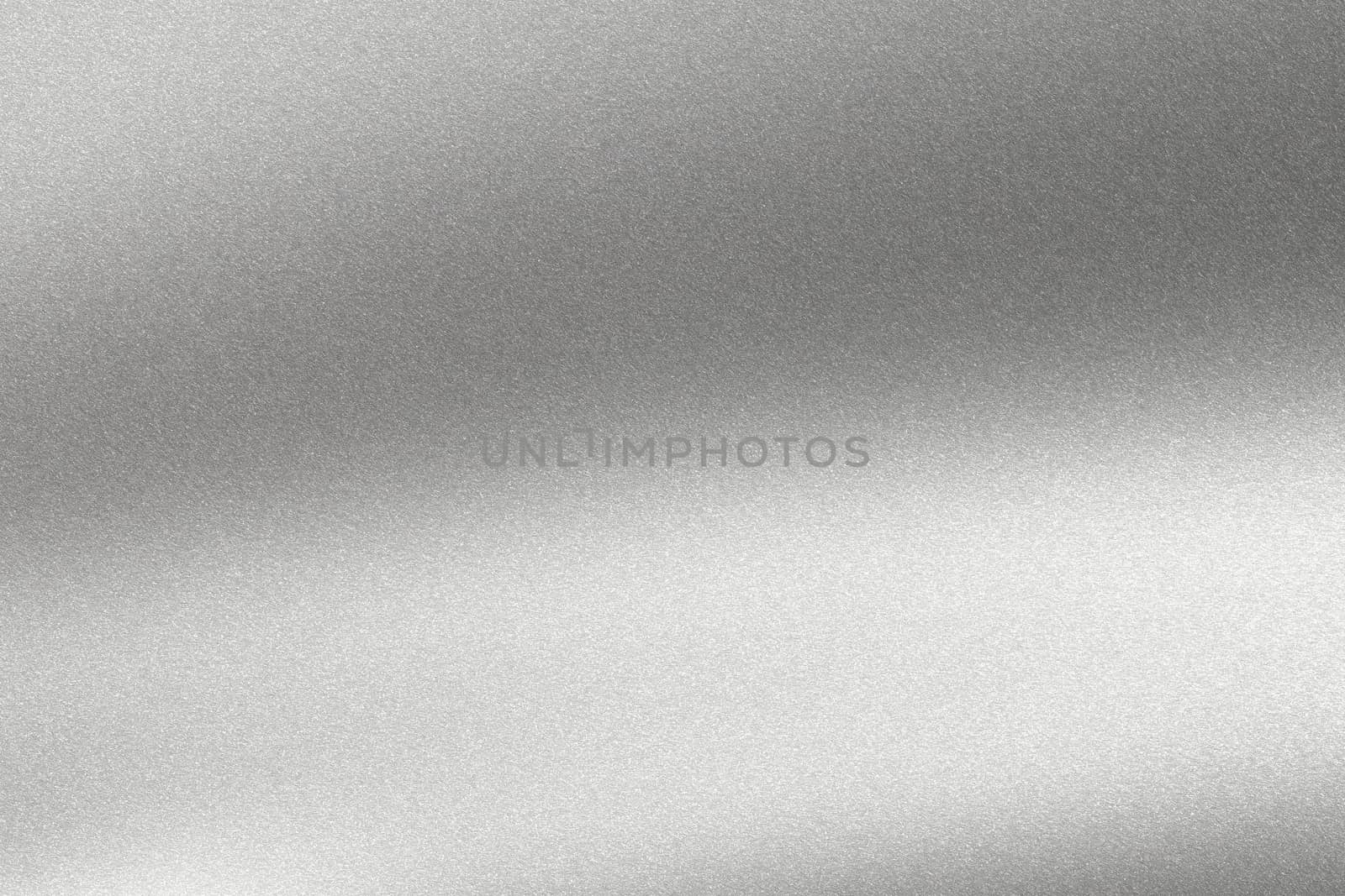 Abstract texture background, light shining on rough silver metal wall