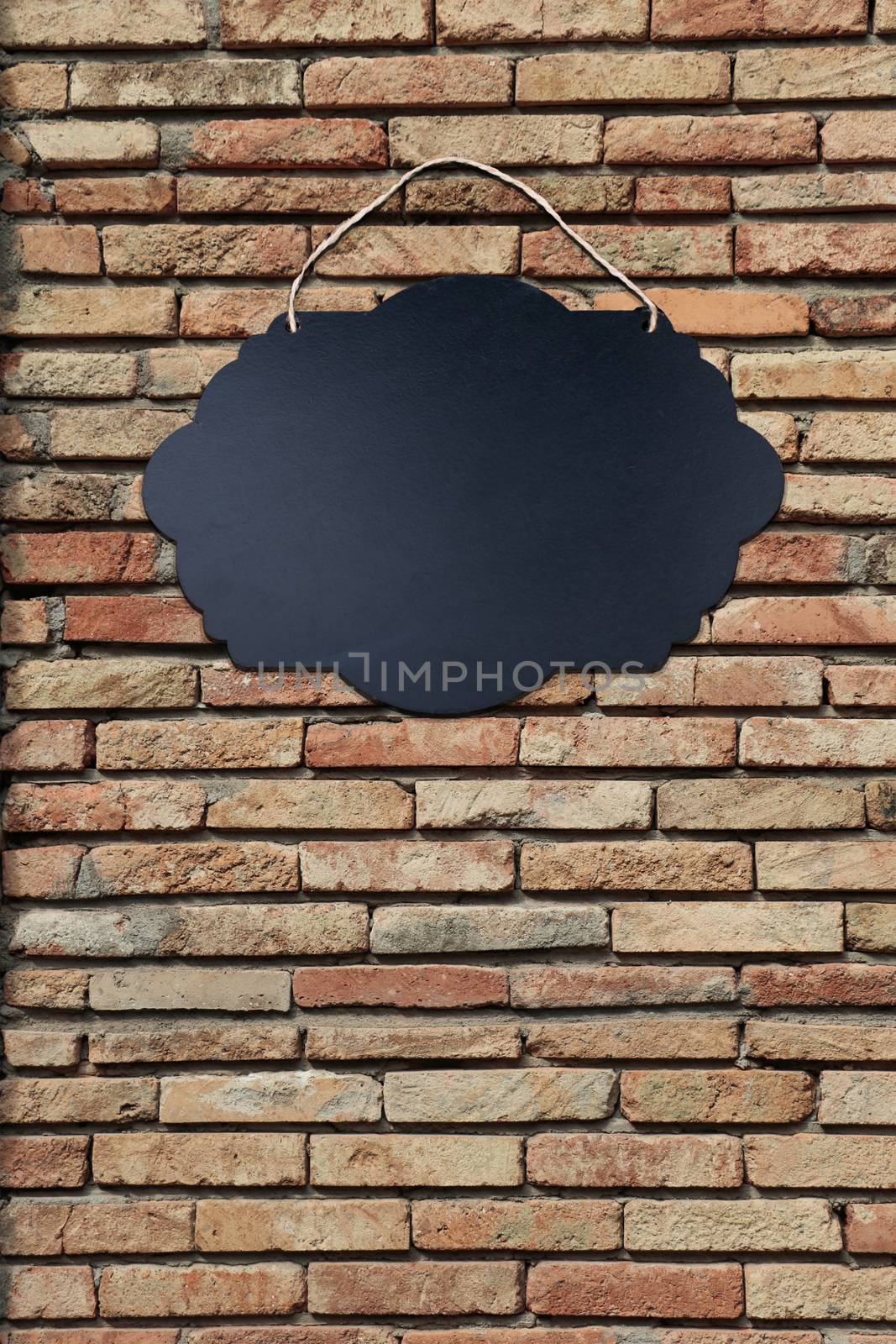 Black Empty Sign Board on brick background by berkay
