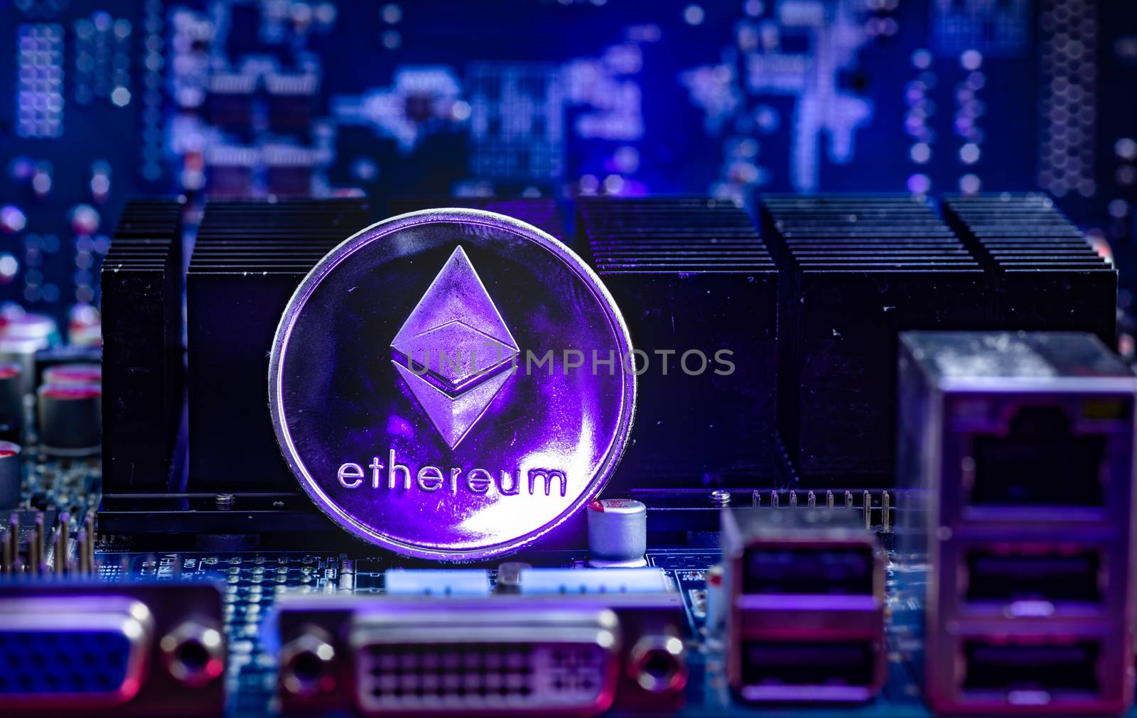 Front view of Ethereum(ETH) cryptocurrency painted with laser stand on computer video card.Bitcoin mining farm concept.