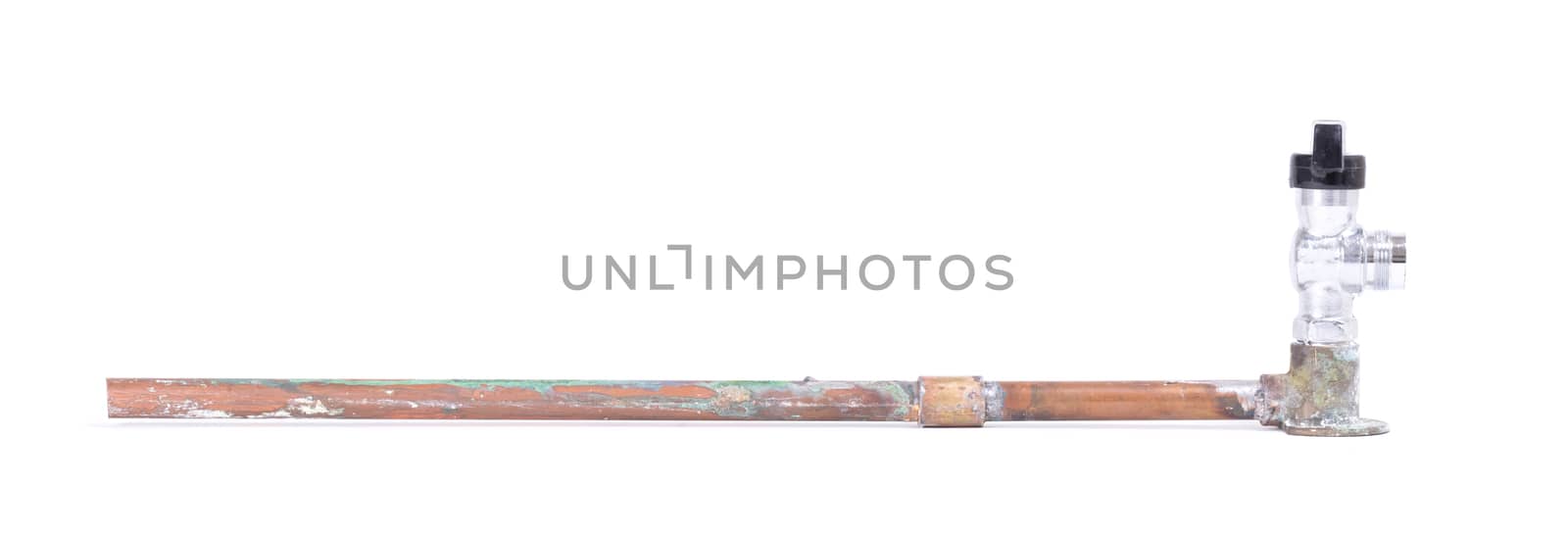 Old brass pipe with metal valve, isolated on a white background