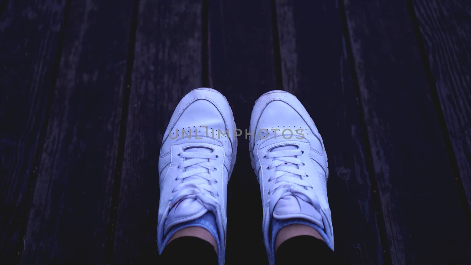 Fashion hipster cool woman with white sneakers, vintage toned colors by natali_brill