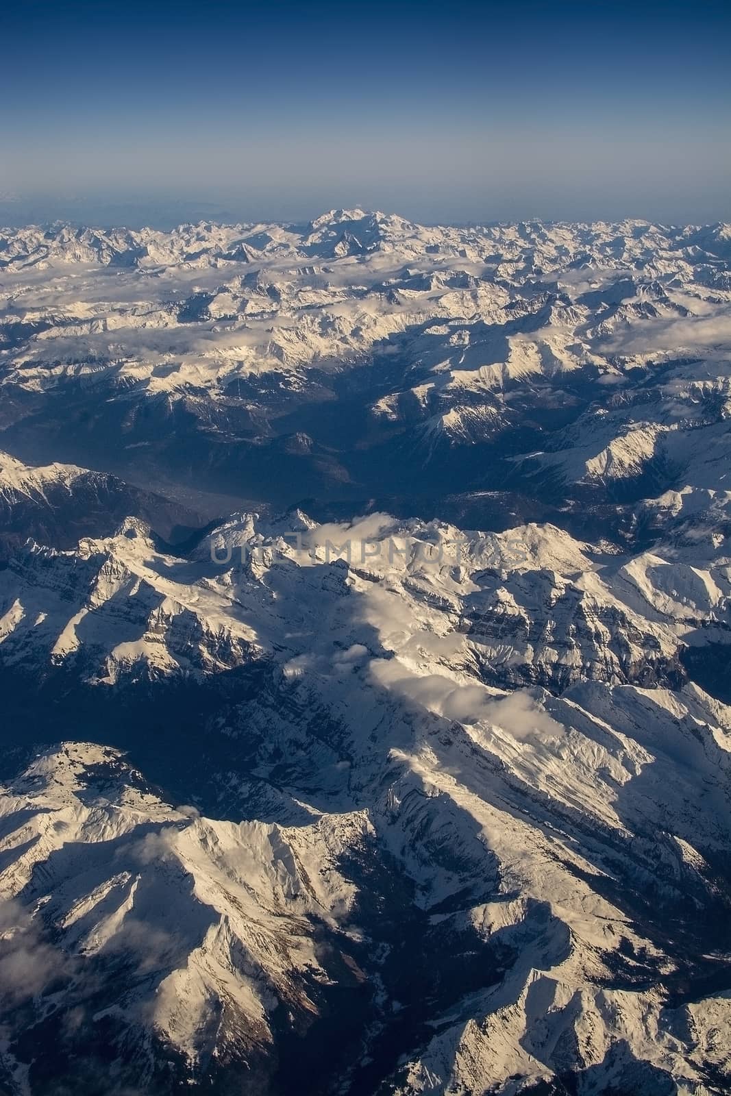 Swiss Alpes with snowy mountain tops aerial  by ArtesiaWells