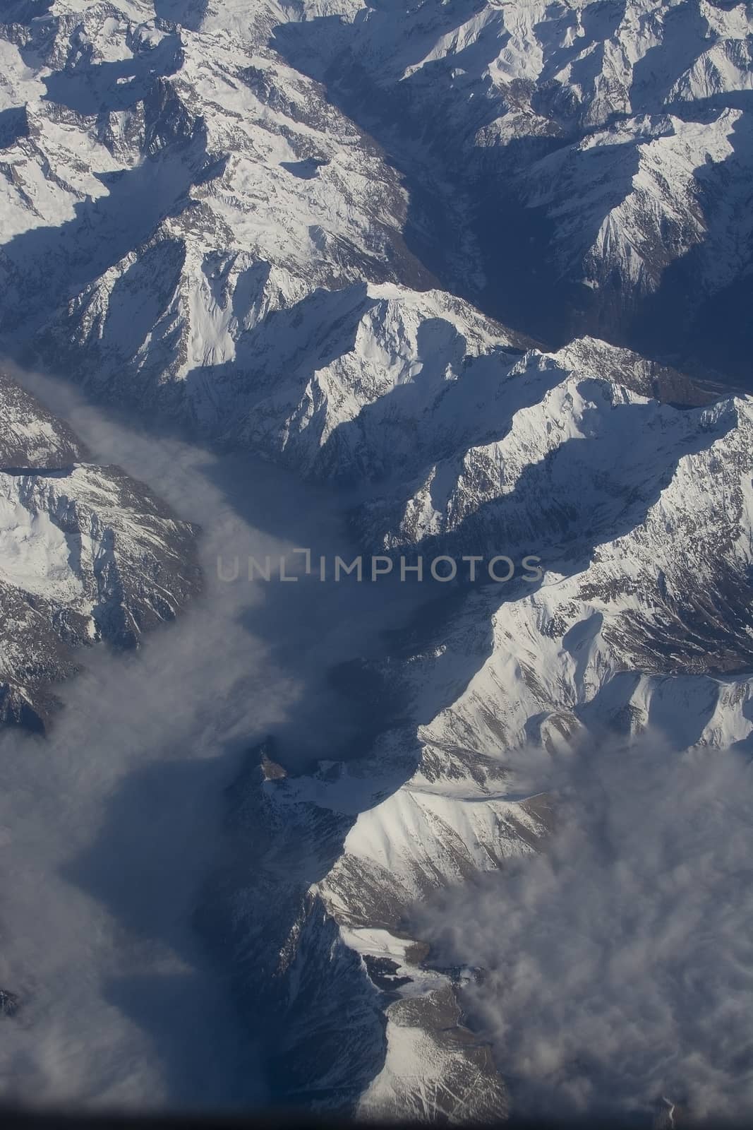 Swiss Alpes with snowy mountain tops aerial  by ArtesiaWells