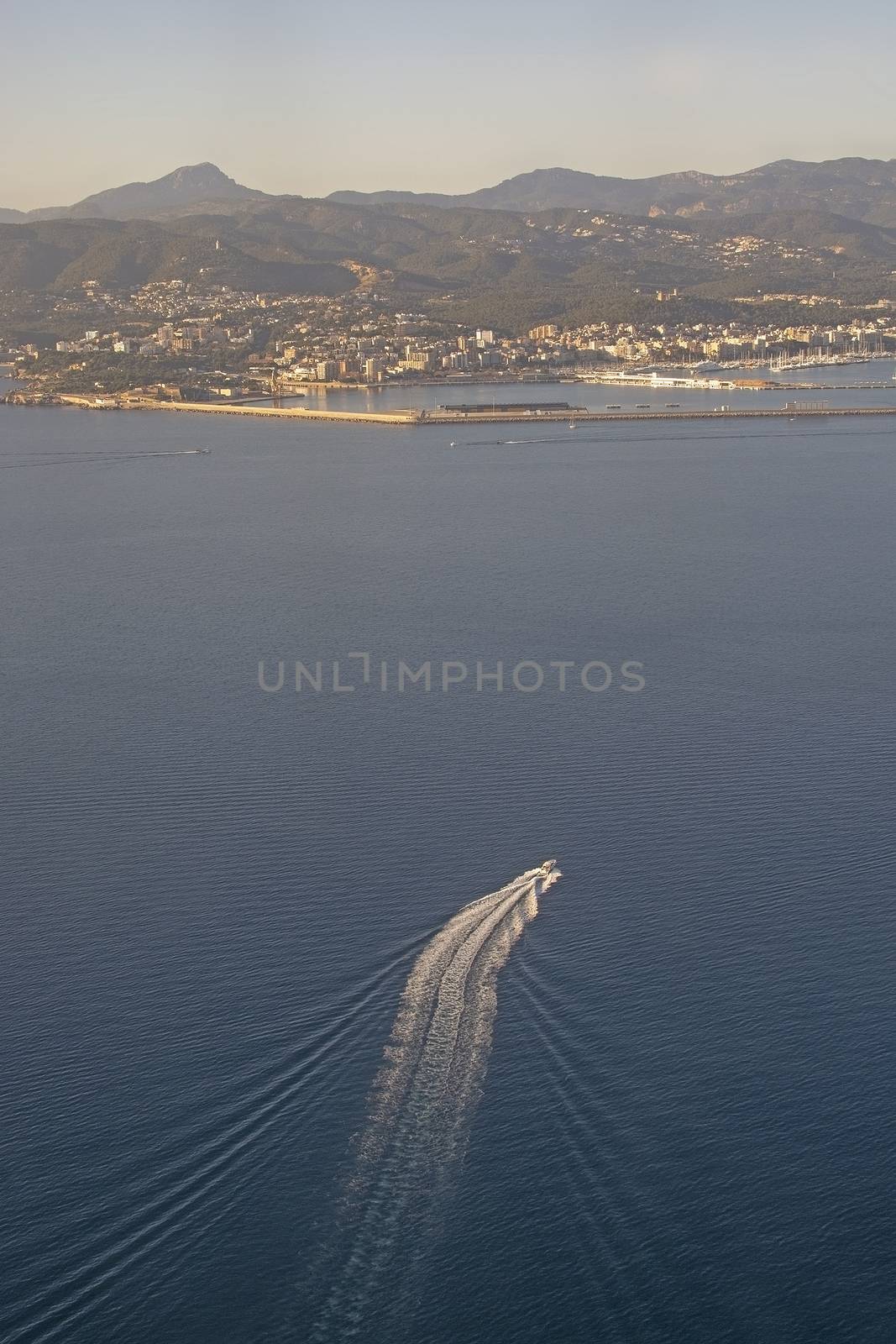 Aerial view of city and boat traffic on a sunny winter day in December in Palma de Mallorca, Spain.