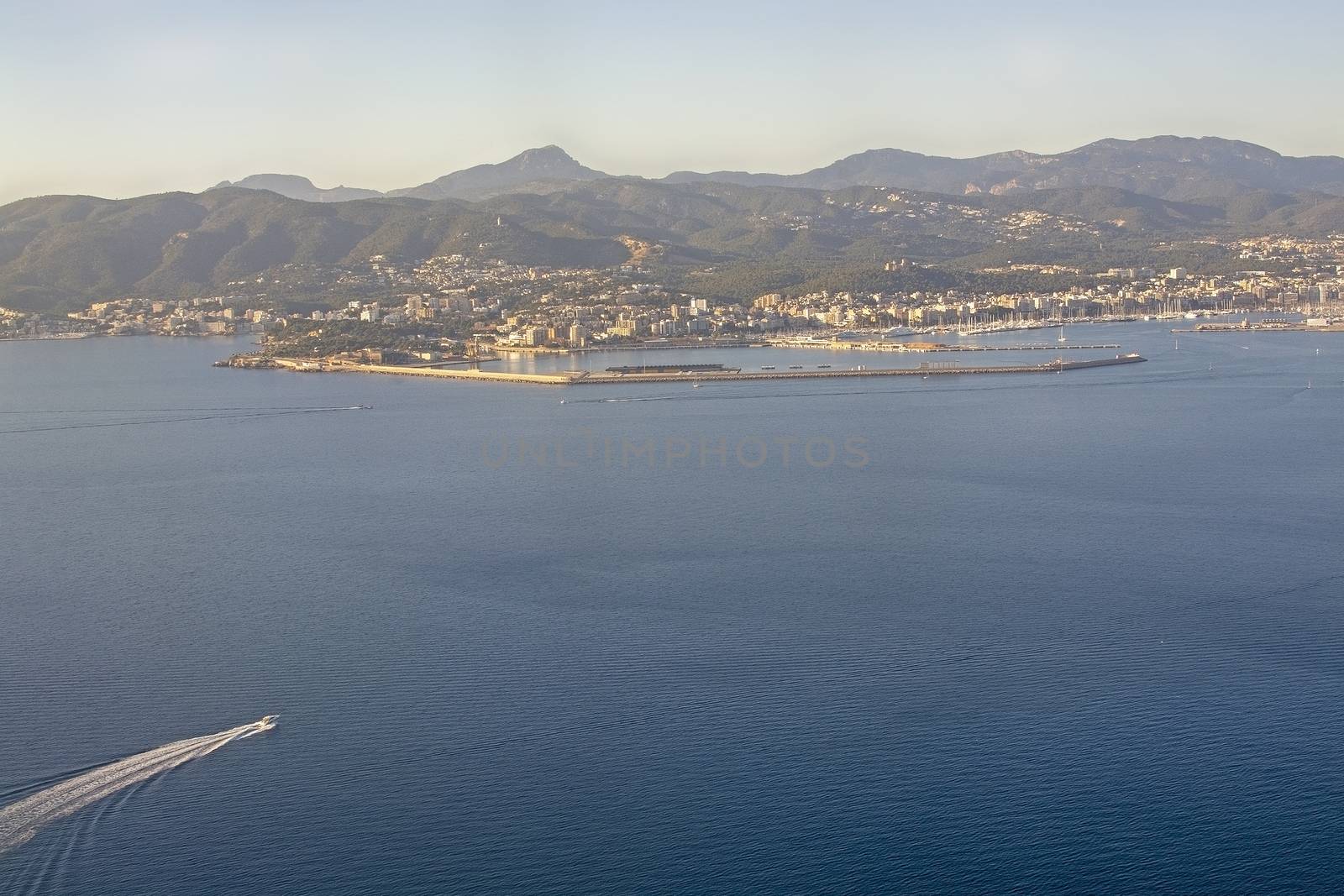 Aerial view of city and boat traffic on a sunny winter day in December in Palma de Mallorca, Spain.