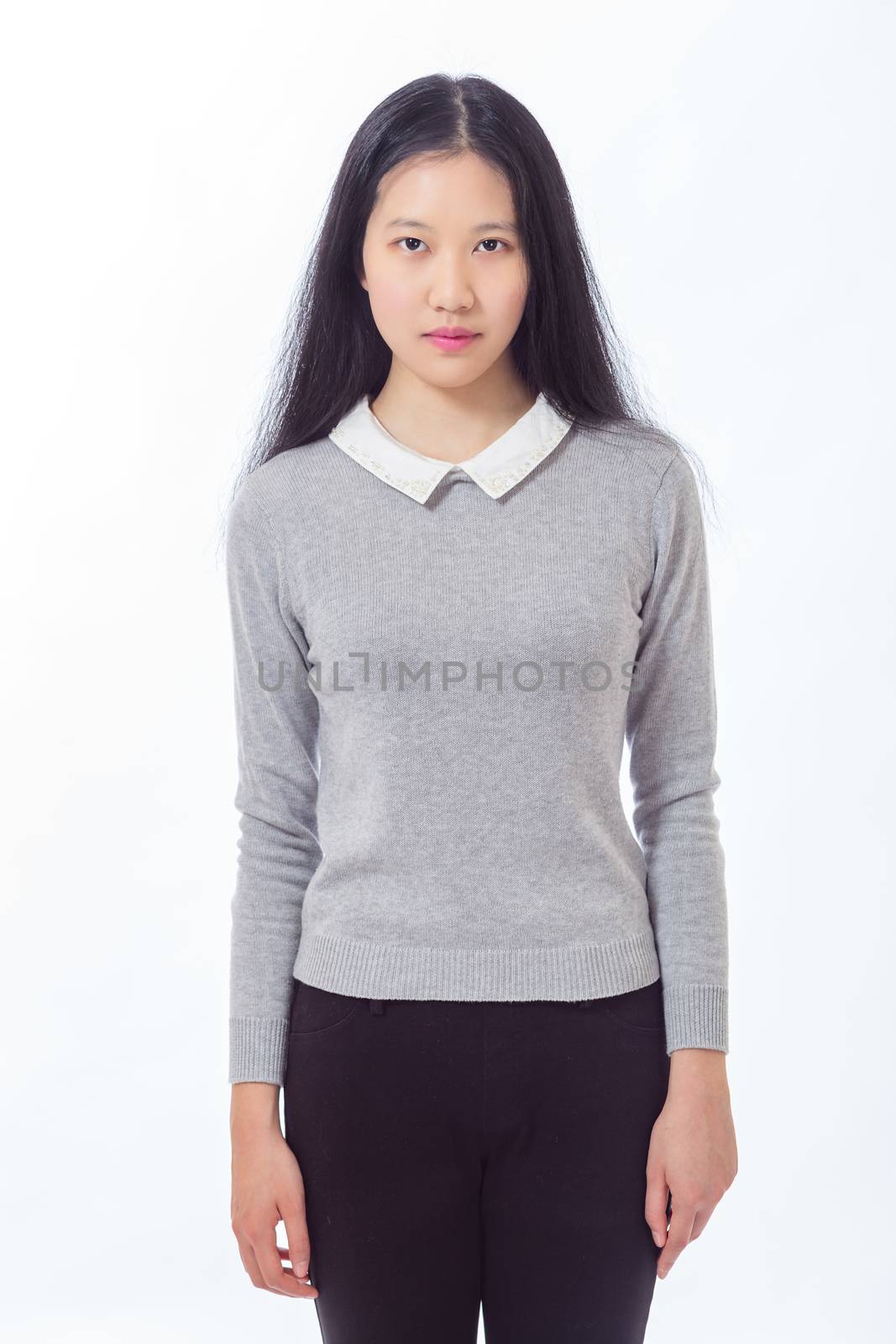 Three quarter length portrait of eenage Asian high school girl