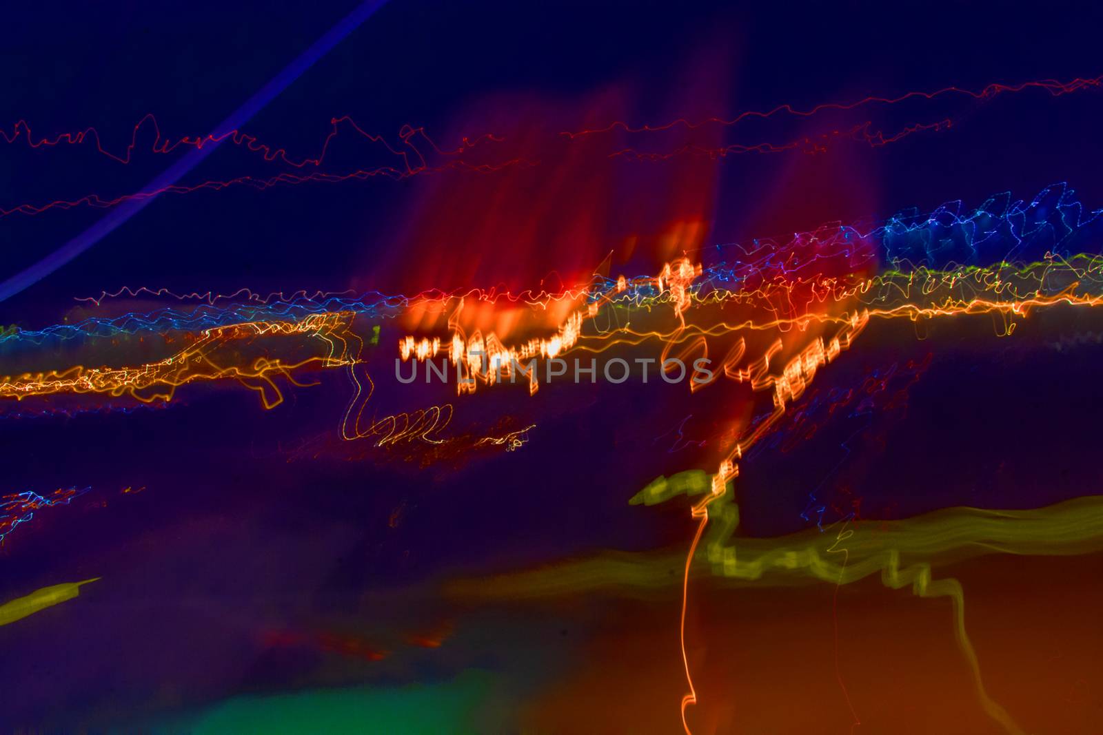 Light painting abstract background texture movement light in dark in various colors.