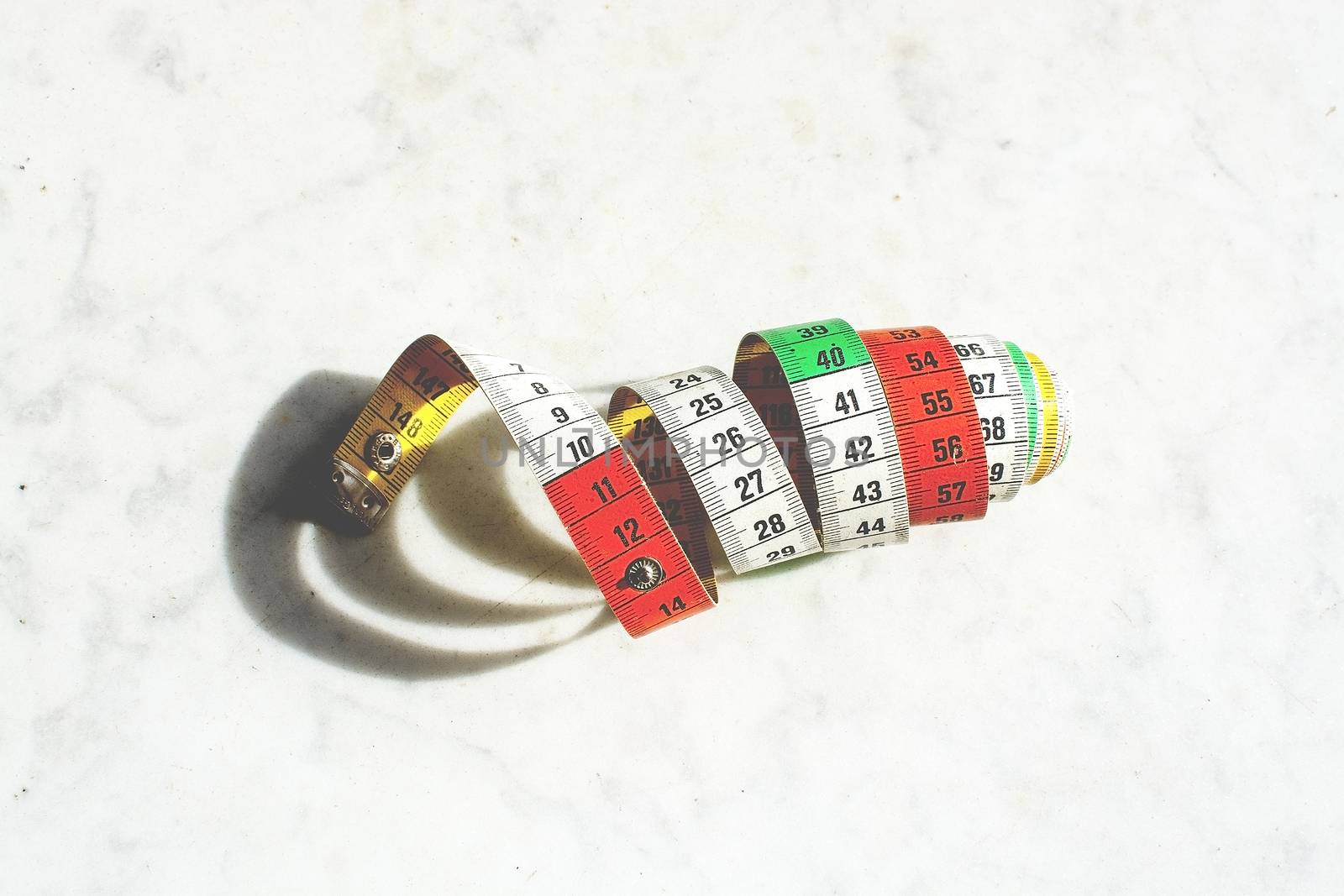 Colorful measuring tape metric system rolled up  by ArtesiaWells