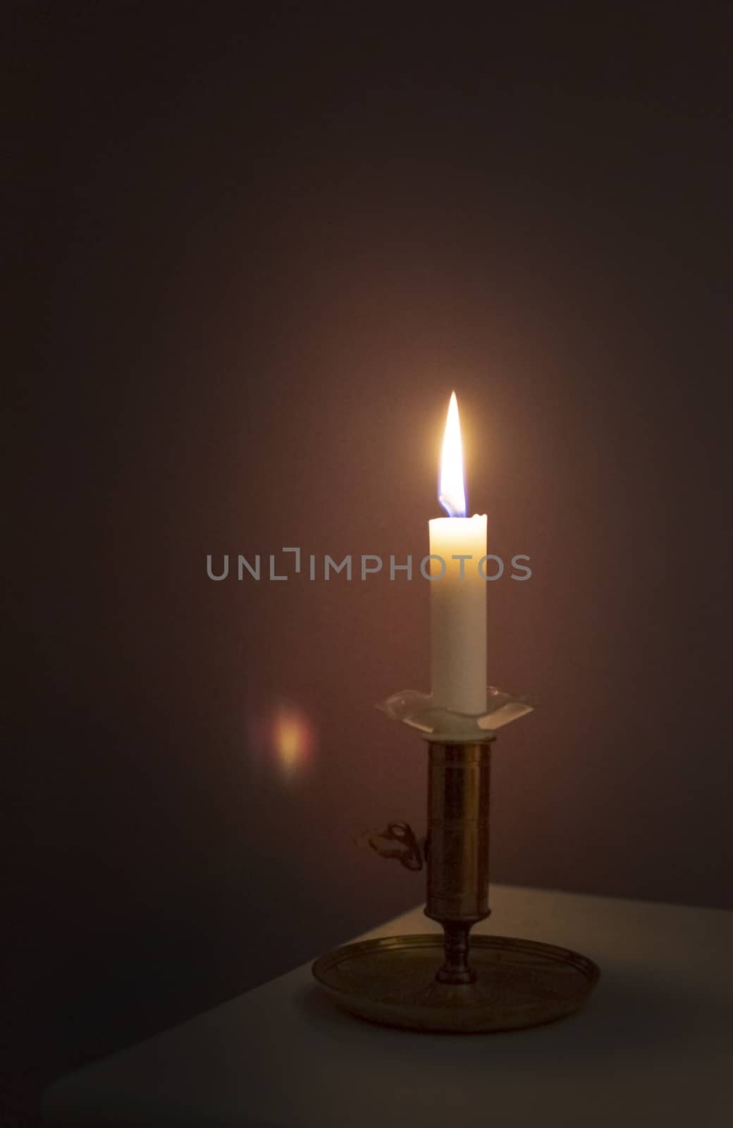 Simple candle burning in darkness by ArtesiaWells