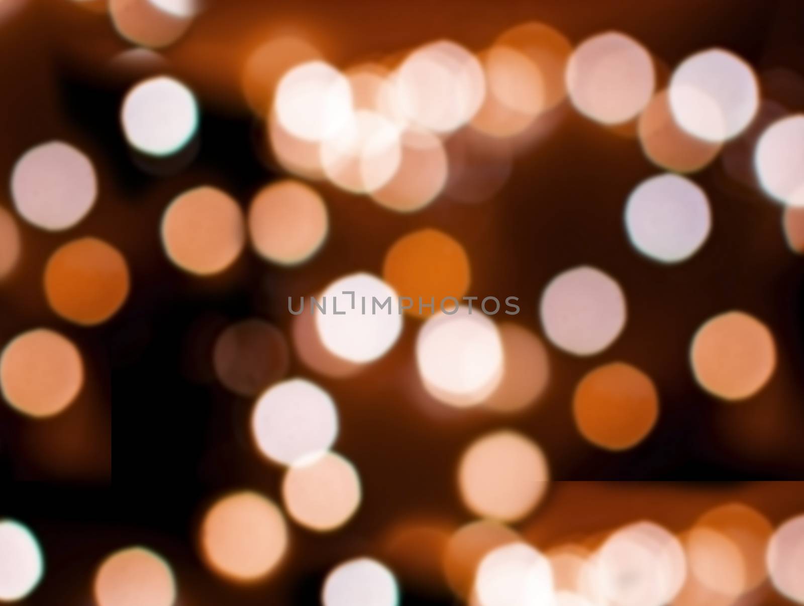 Bokeh lights defocussed burnt orange festive winter background texture