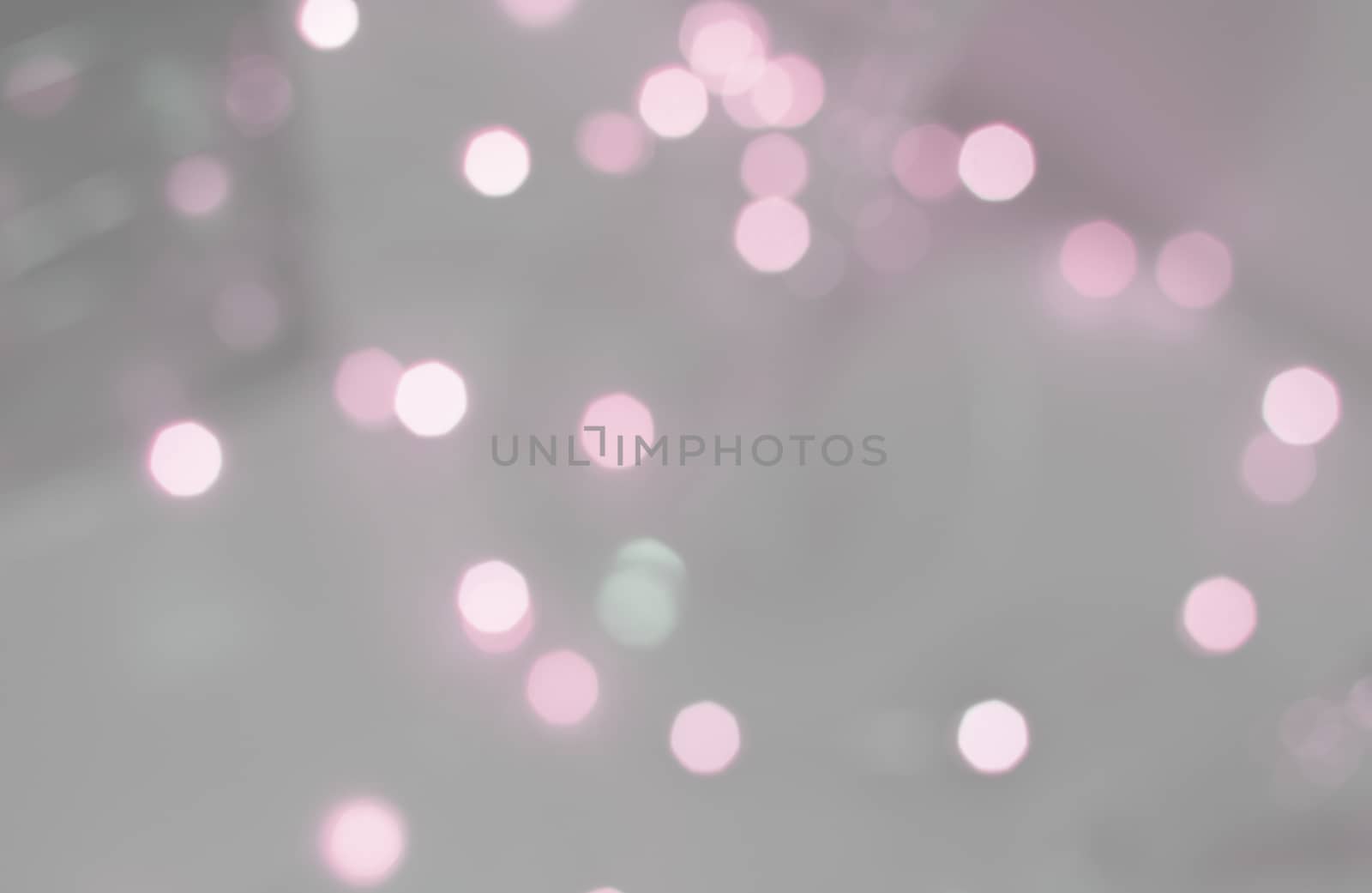 Pink bokeh lights defocussed festive winter background texture