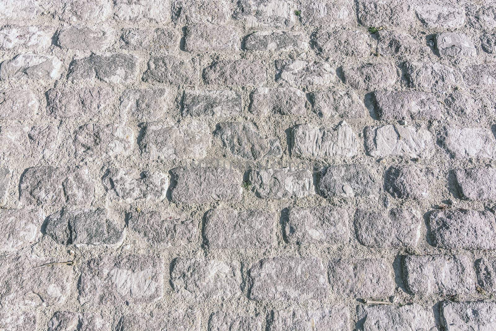 Old vintage cobble stone street background texture