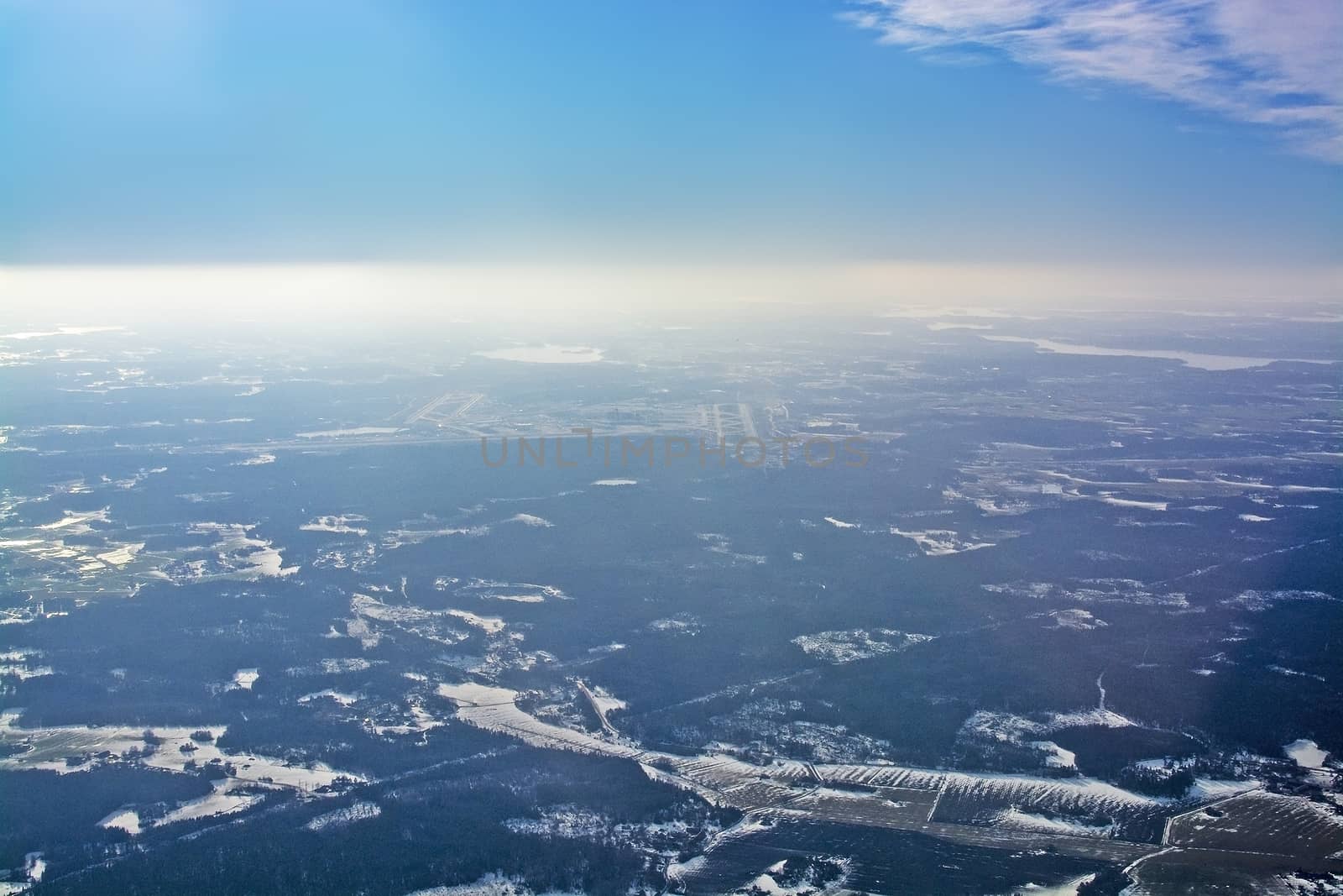 Aerial view over Arlanda airport in sunhaze, Sweden in February.