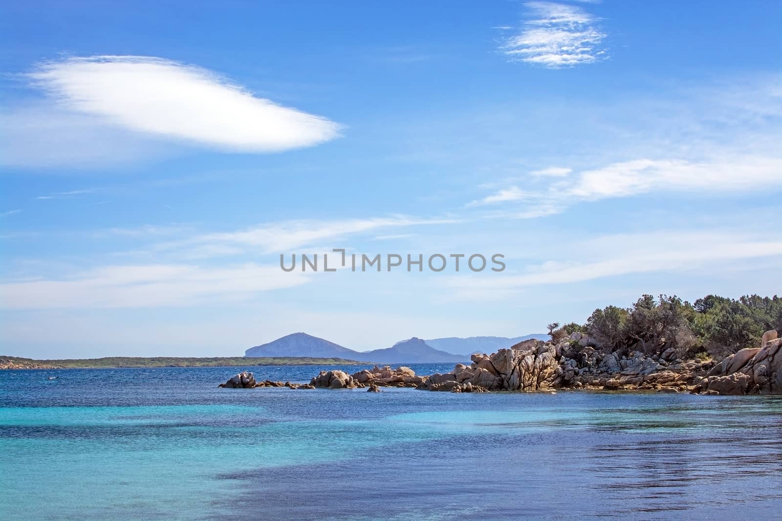 Seascape from a winter beach and blue and green sea in Costa Smeralda, Sardinia, Italy in March.