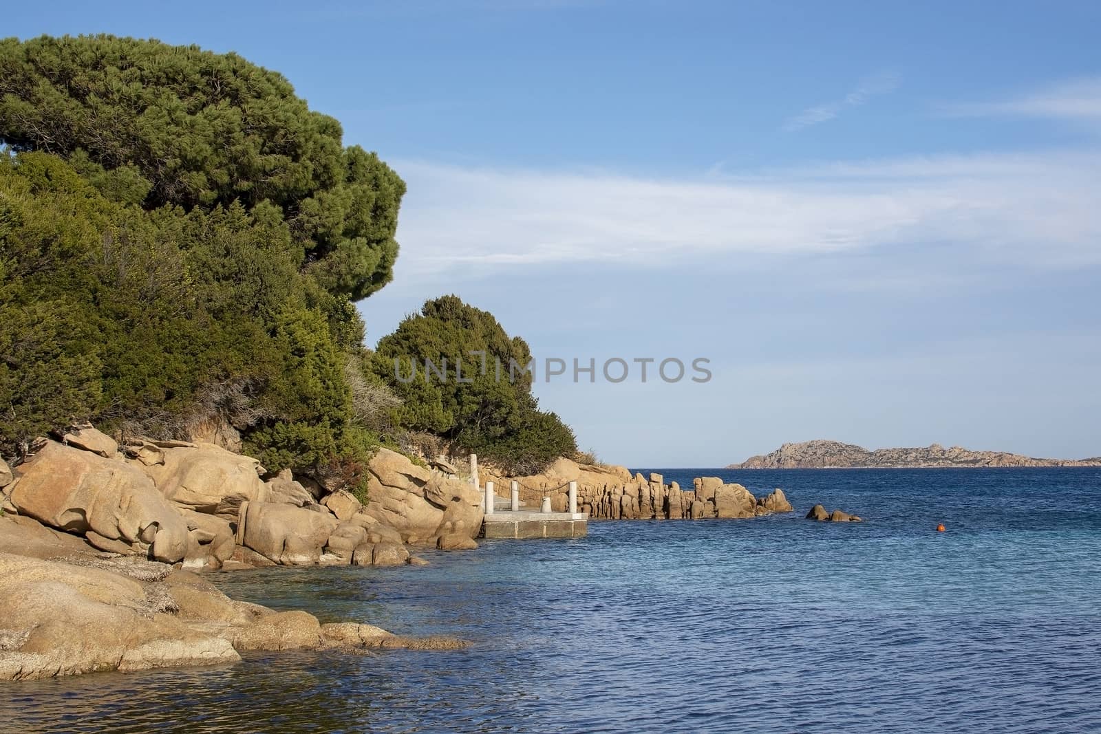 Seascape from a winter beach and blue and green sea in Costa Smeralda, Sardinia, Italy in March.