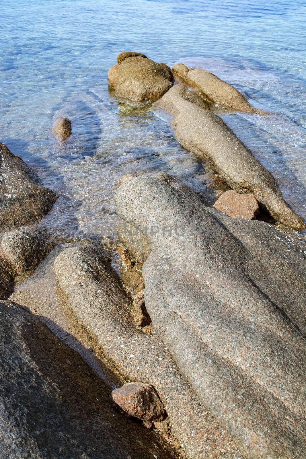 Beach with granite rocks in Costa Smeralda Sardinia by ArtesiaWells