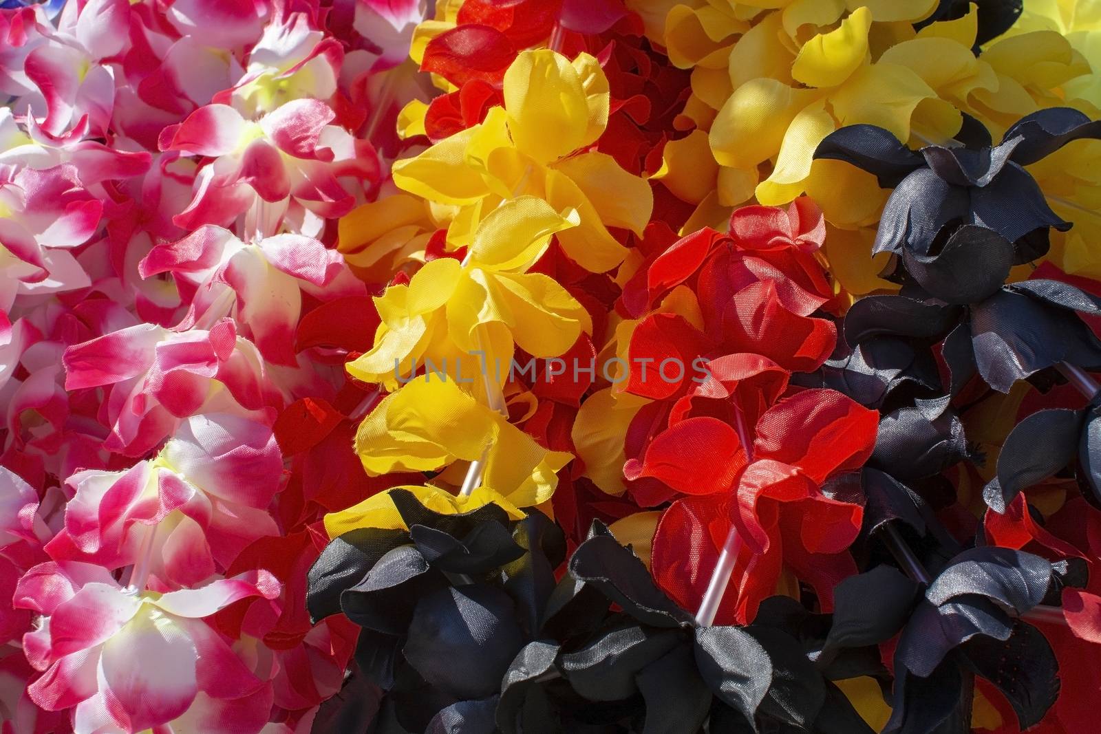 Lei flower garland in many colours closeup background