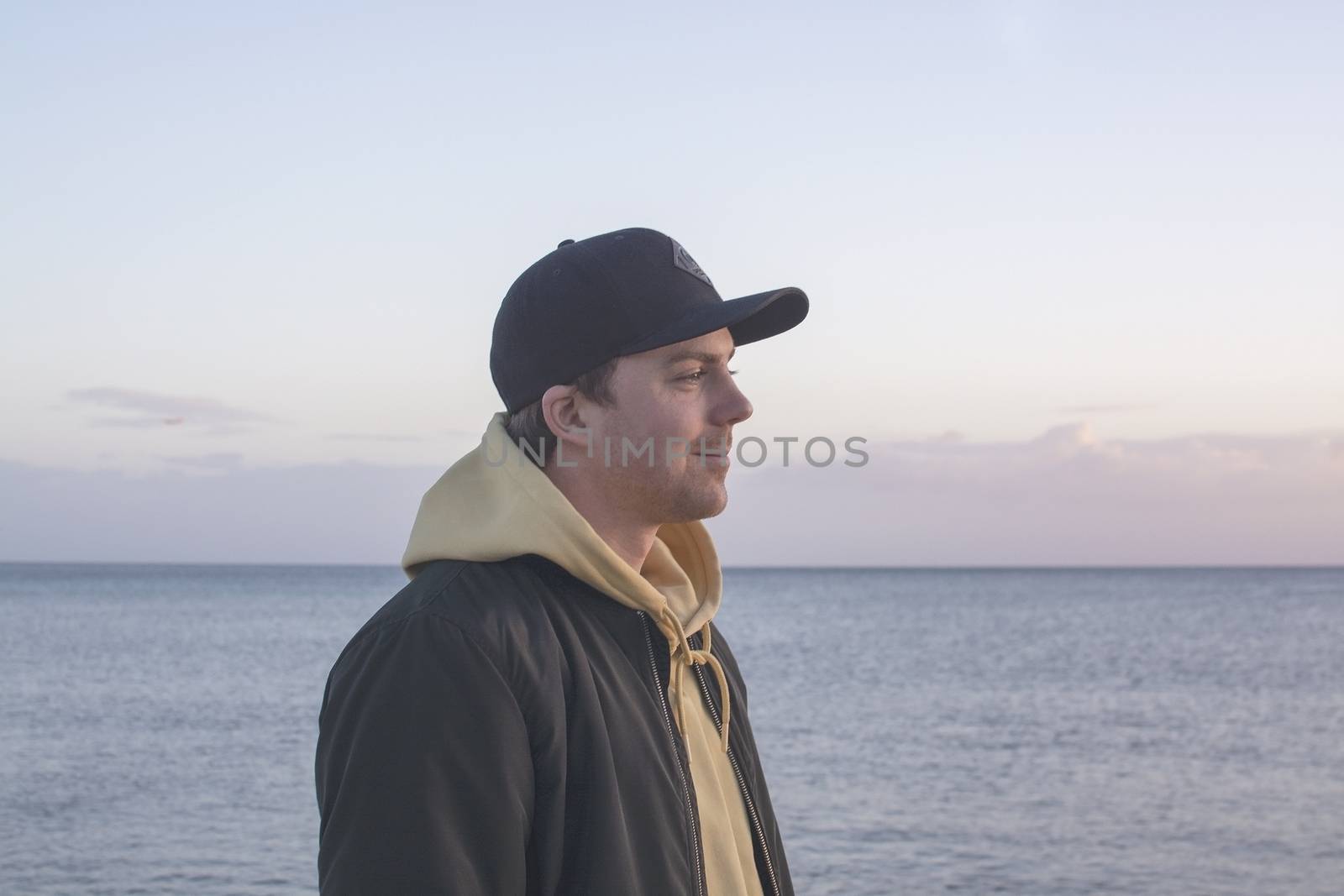 Profile shot of handsome smiling natural and casual looking male by ArtesiaWells