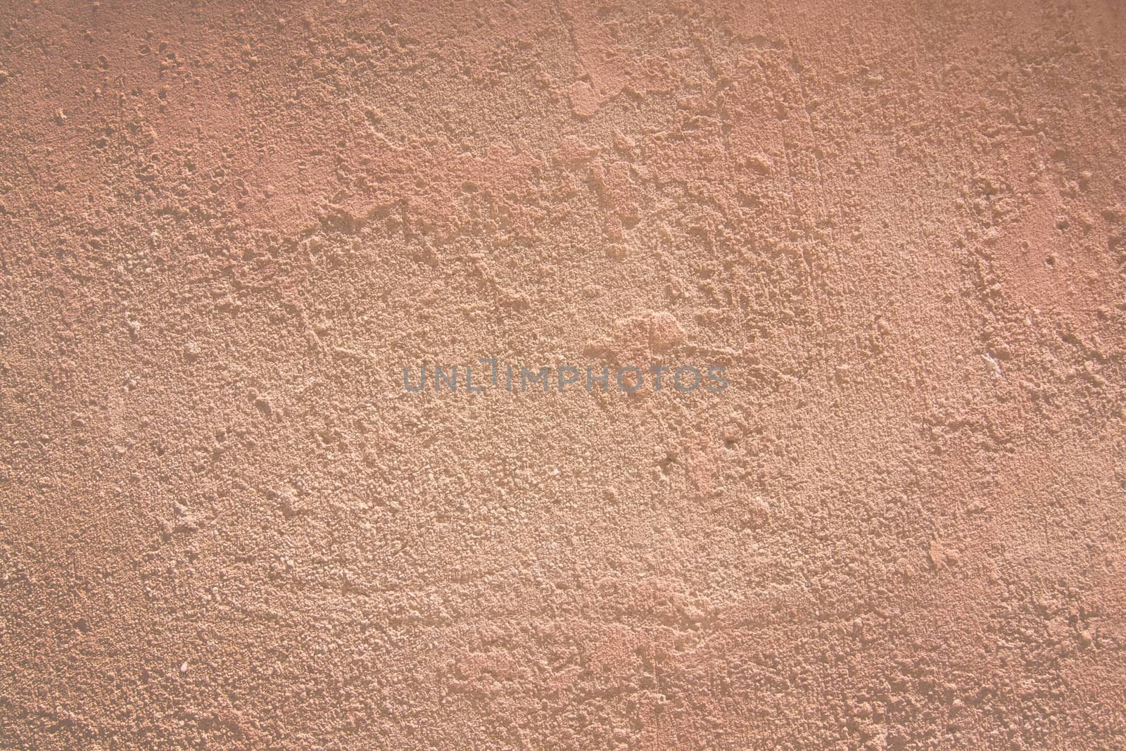 Red terracotta background texture closeup toned in trend color Living Coral.