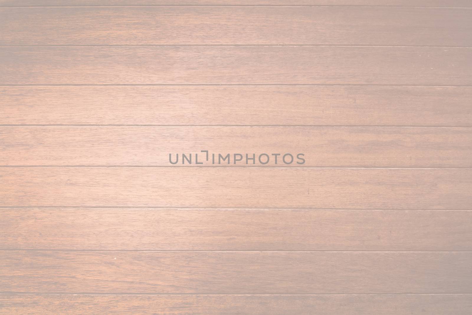 Brown wood planks background texture closeup toned in trend color Living Coral.