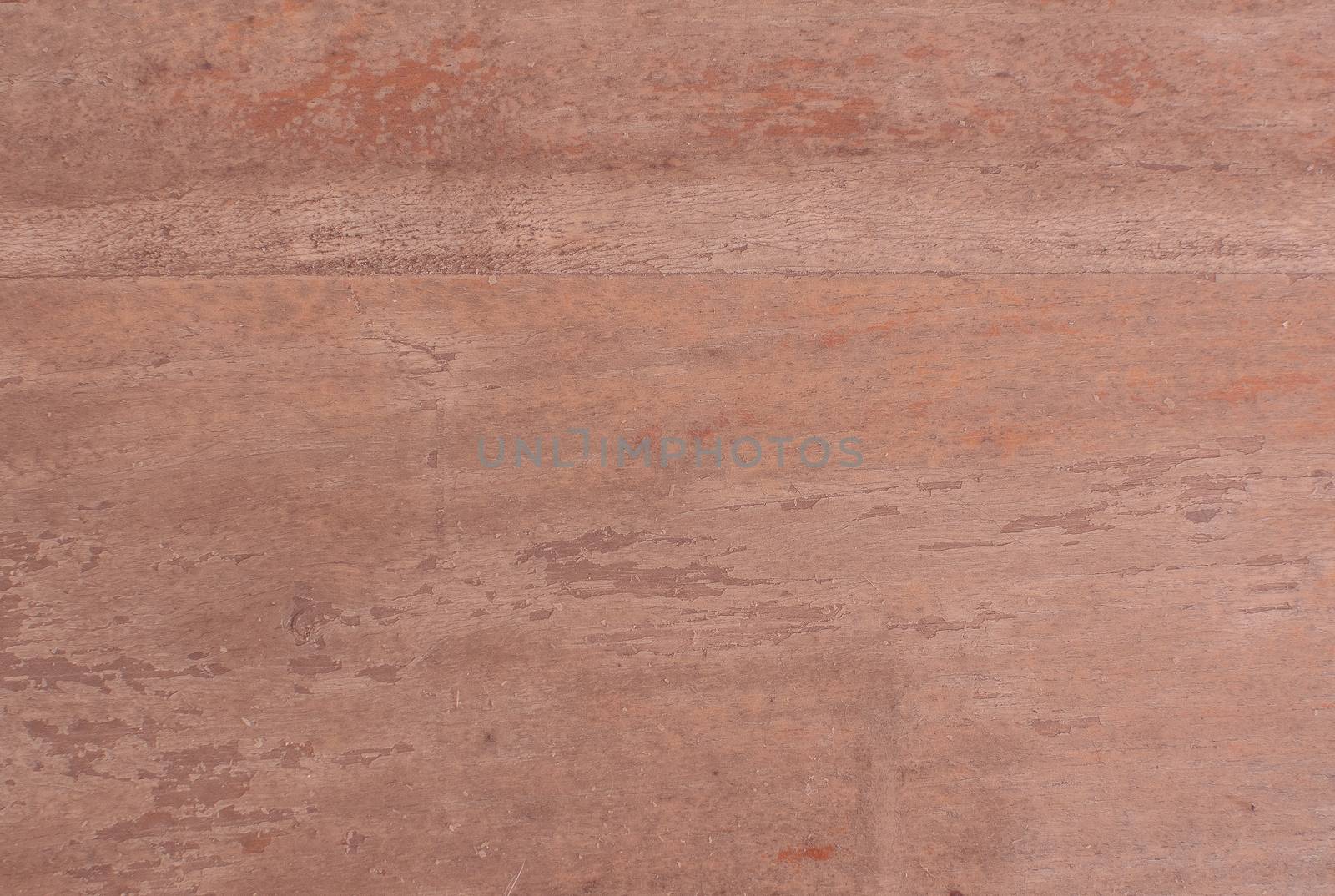 Brown raw rustic shabby wood background texture toned in trend color Living Coral.