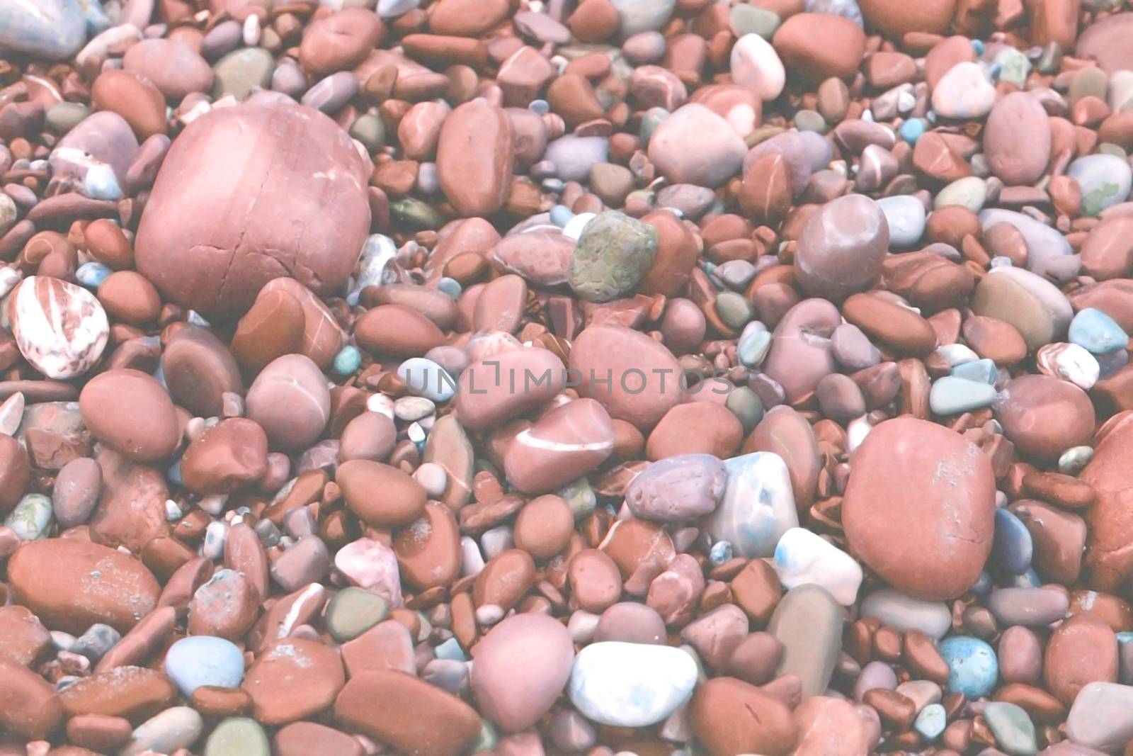 Stones rounded by waves toned in Living Coral shades by ArtesiaWells