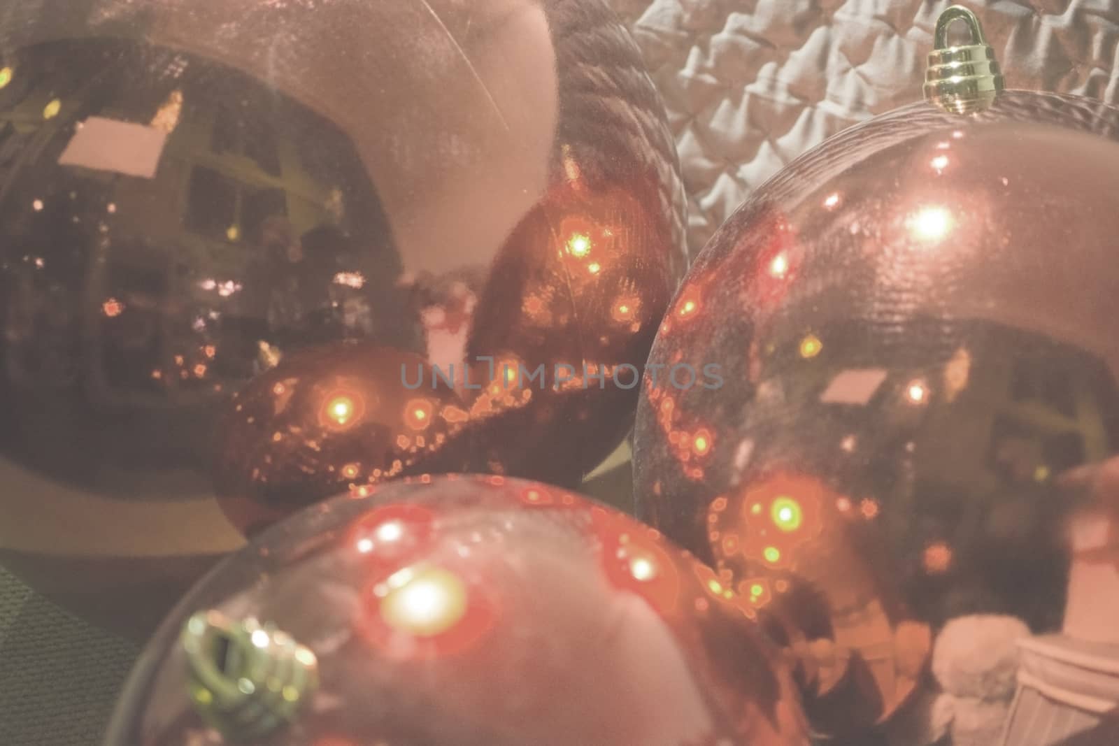 Background blur three red Christmas baubles in Living Coral shad by ArtesiaWells