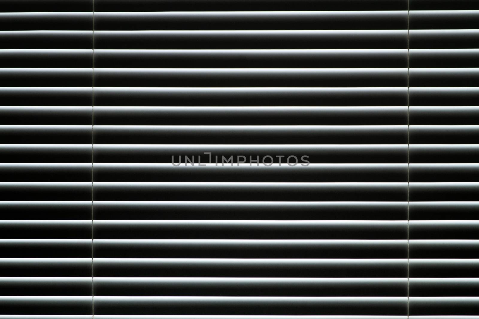 Plastic closed window blinds in the room. by fogen