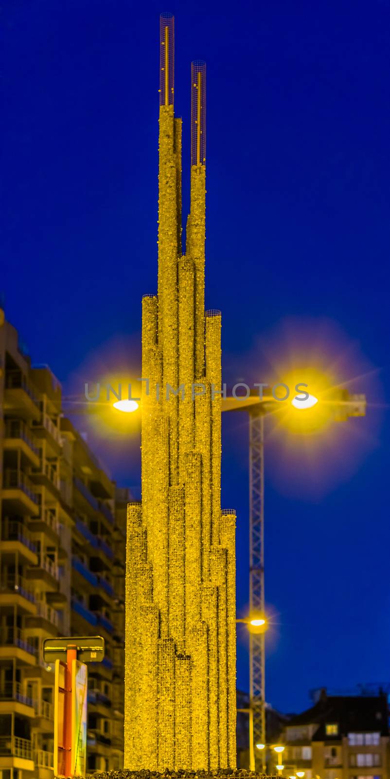 city decoration, simple art work made out of mesh cylinders filled with shiny rocks, cylinders in different sizes