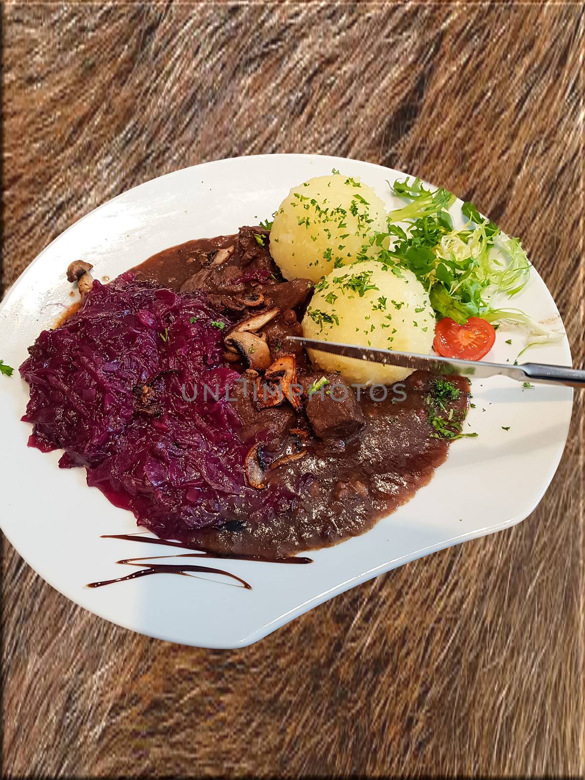 Gourmet game fillet with potato dumplings, goulash garnished