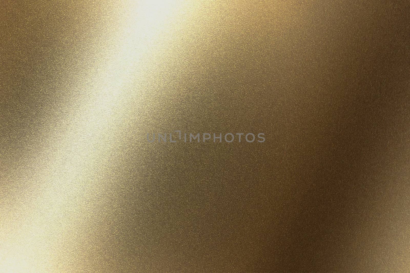 Abstract texture background, light shining on golden metal in dark room