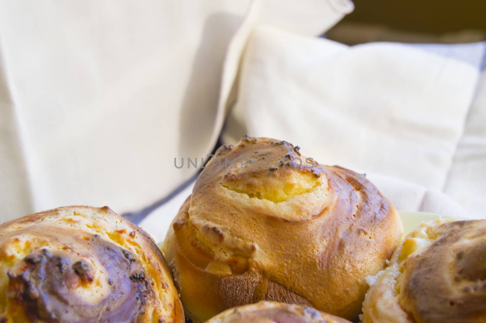 Hot sweet rolls in the shape of snails baked in a homemade bakery, closeup, concept of small business, bakeries, mini-hotel.