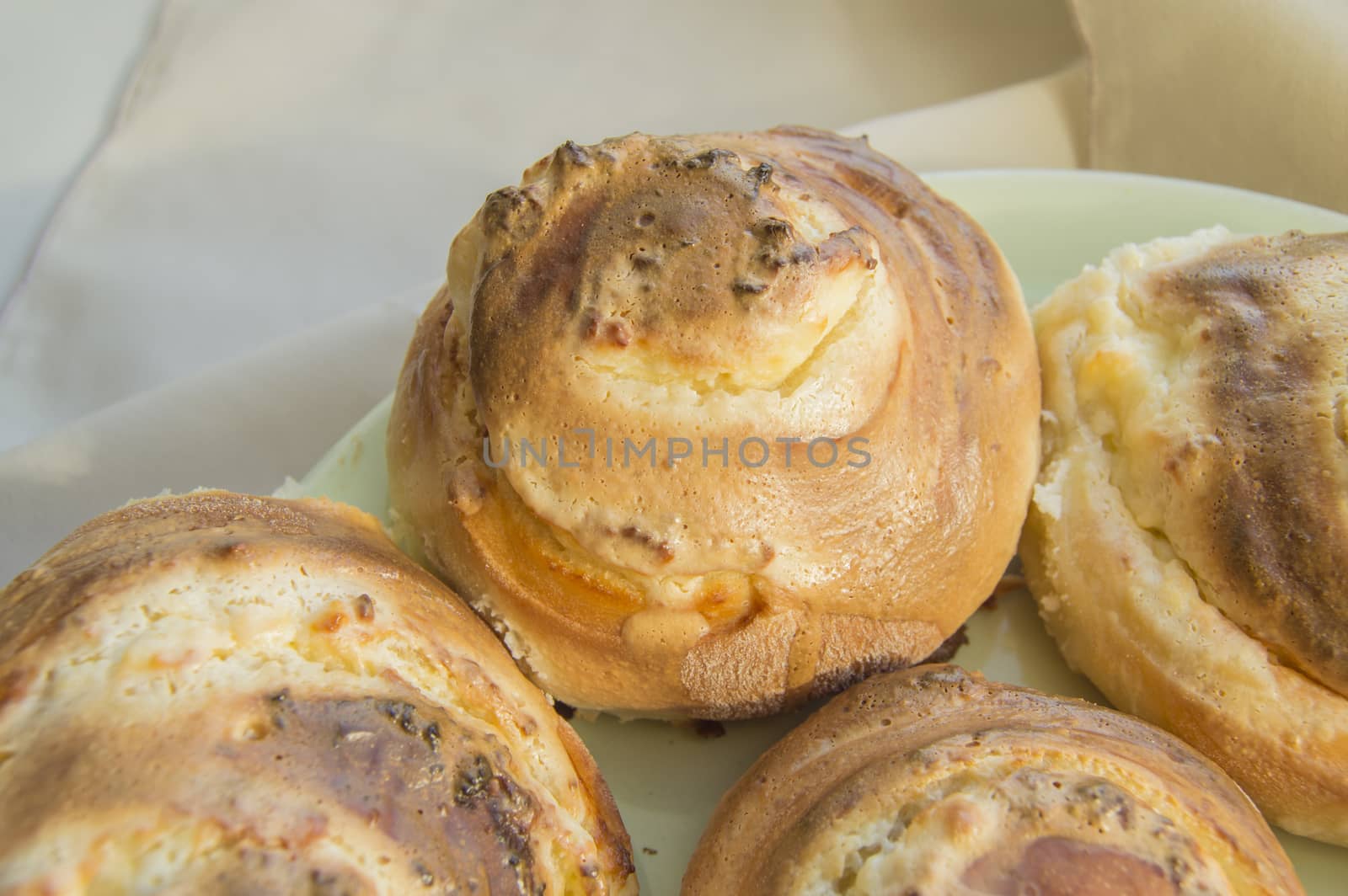 Hot sweet rolls in the shape of snails baked in a homemade bakery, closeup, concept of small business, bakeries, mini-hotel.