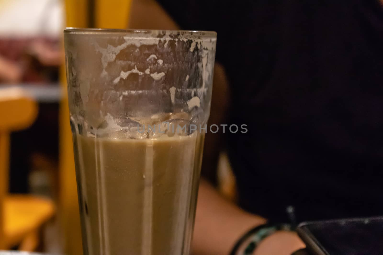 a closeup side view shoot of milky coffee. photo has taken from a cafe at izmir/turkey.
