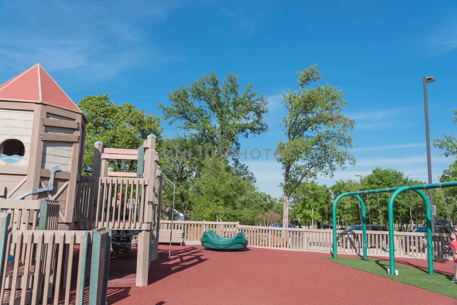 Wooden playground, castle-inspired structure with soft rubber surface near Dallas, Texas, USA
