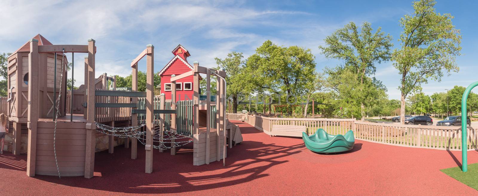 Panorama view castle-inspired structure, elaborate wooden playground with soft rubber surface near Dallas, Texas, USA