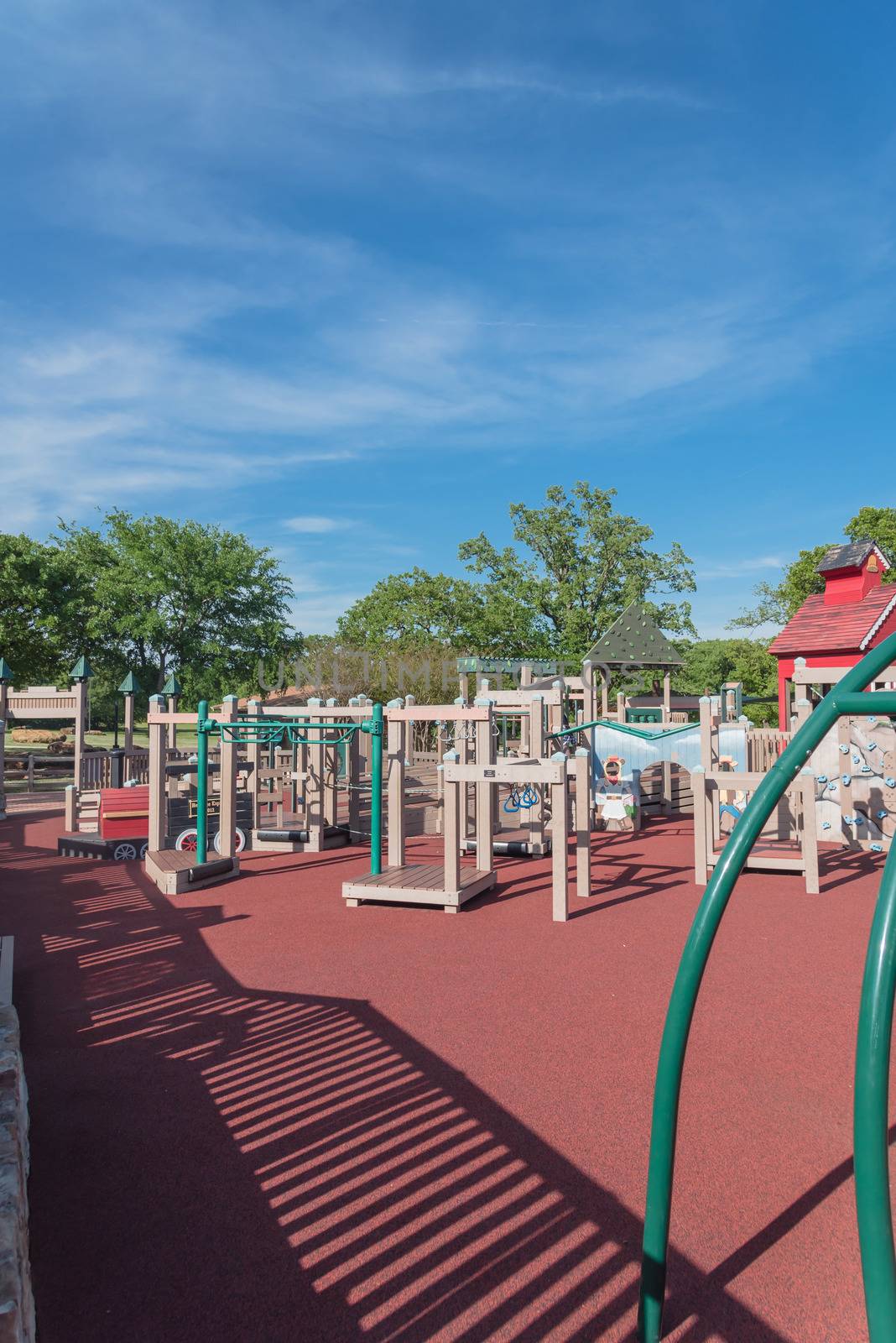 Wooden playground, castle-inspired structure with soft rubber surface near Dallas, Texas, USA
